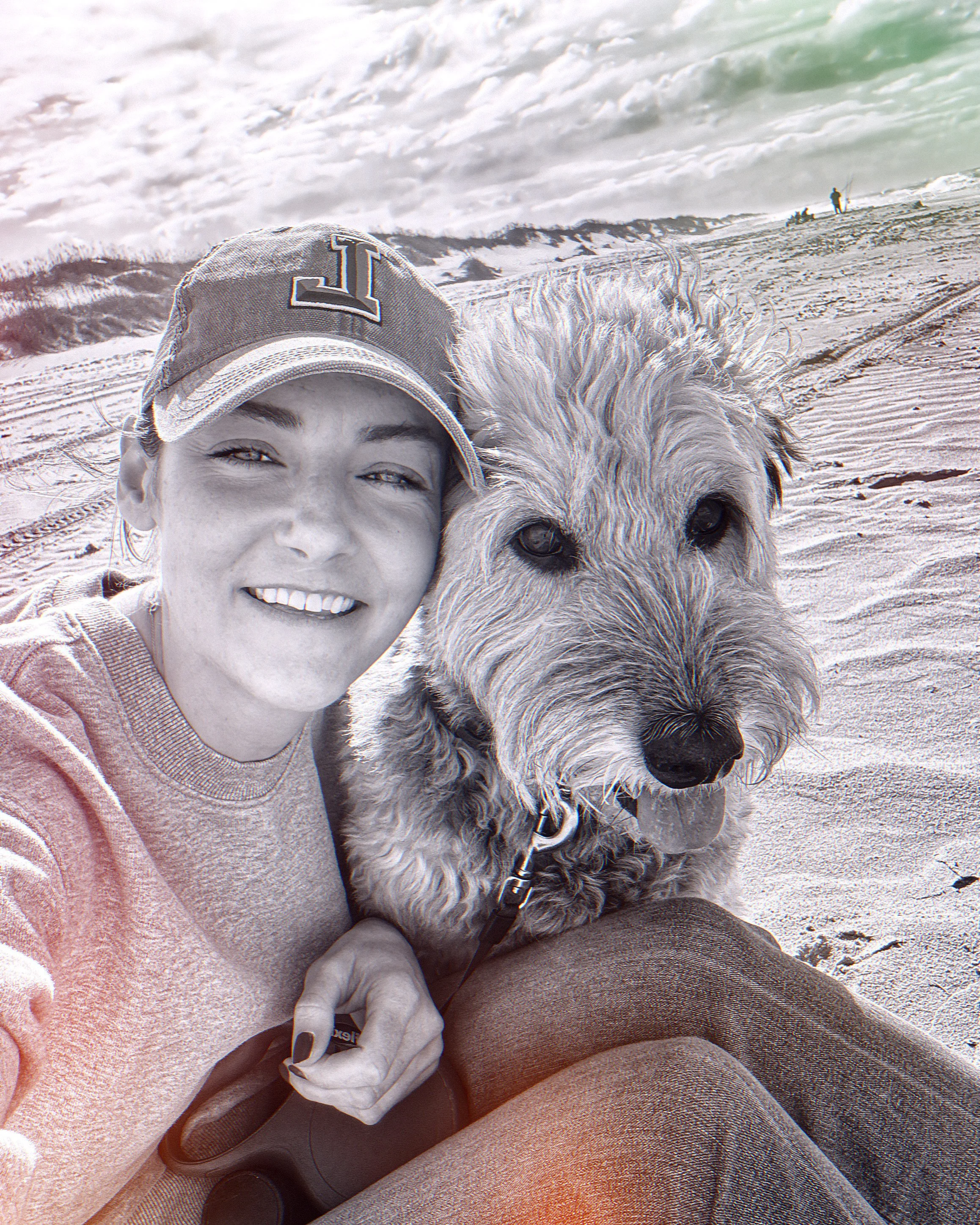 Anna Berteele smiling with her dog at the beach, founder of Coacha Vida Wellness strategic health coaching for women