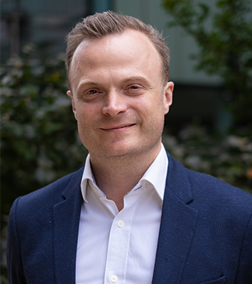 A headshot of Dominic Arnall