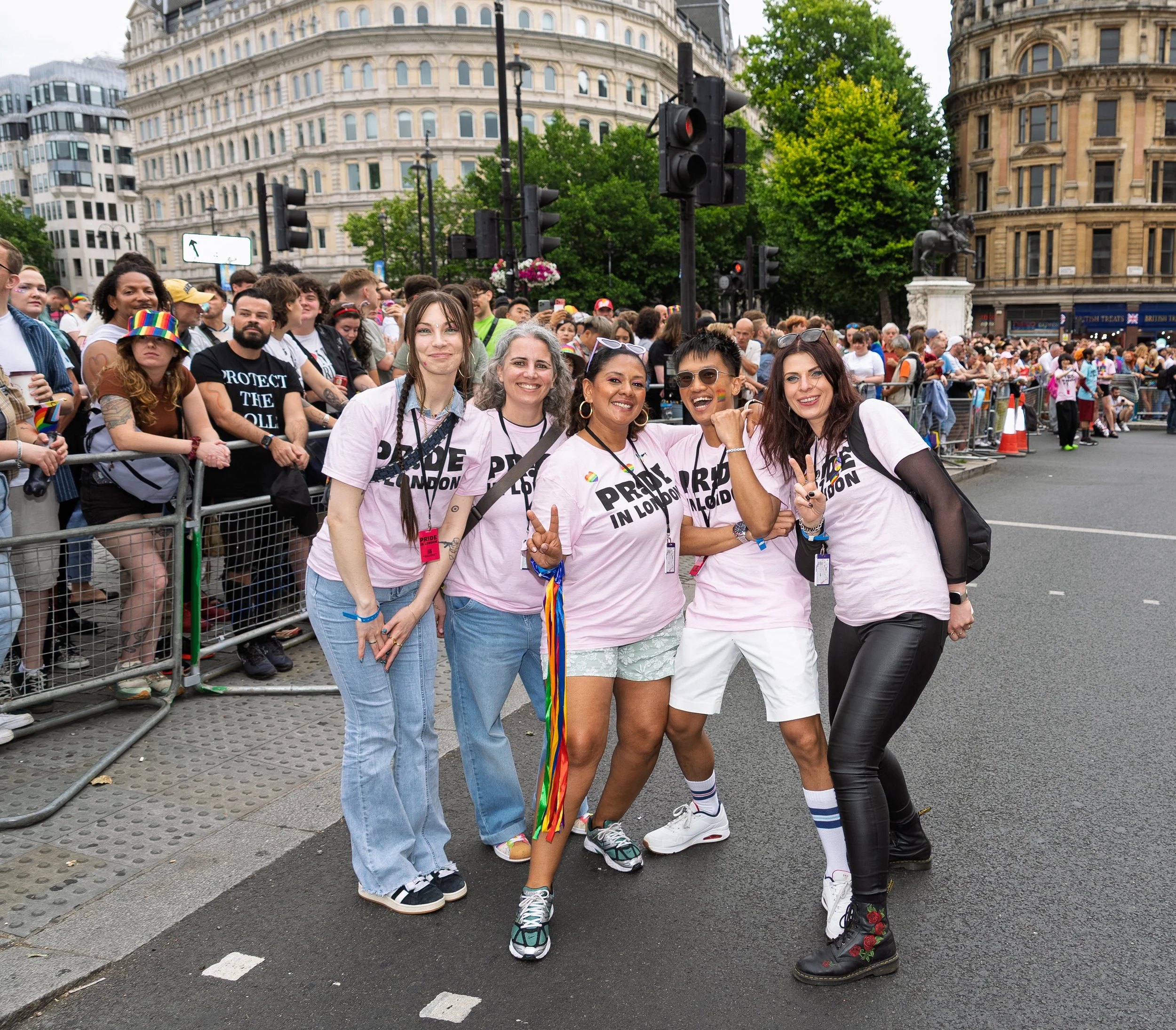 Five Pride in London parade stewards, posing together