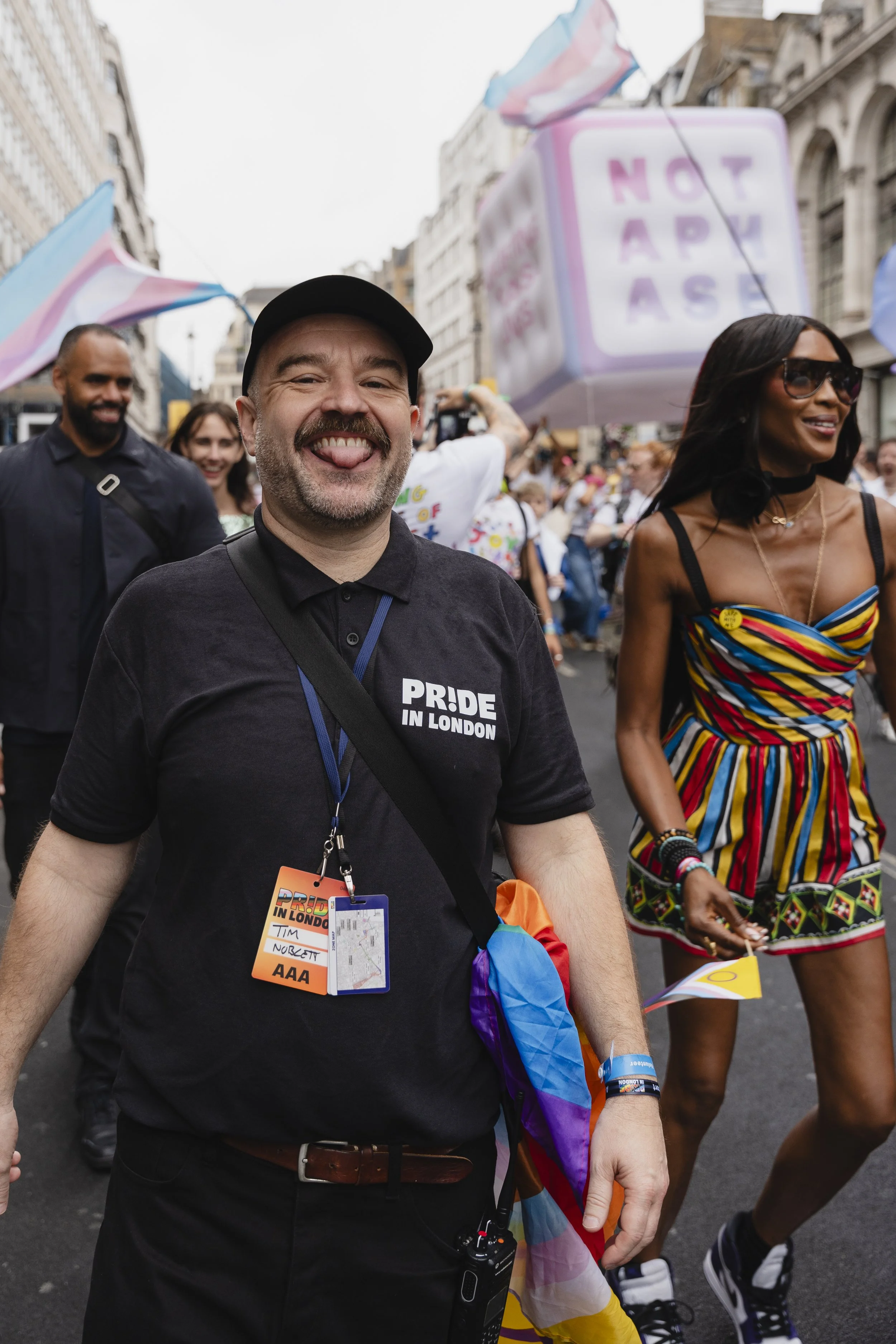 A Pride in London Volunteer at the Front of the Parade