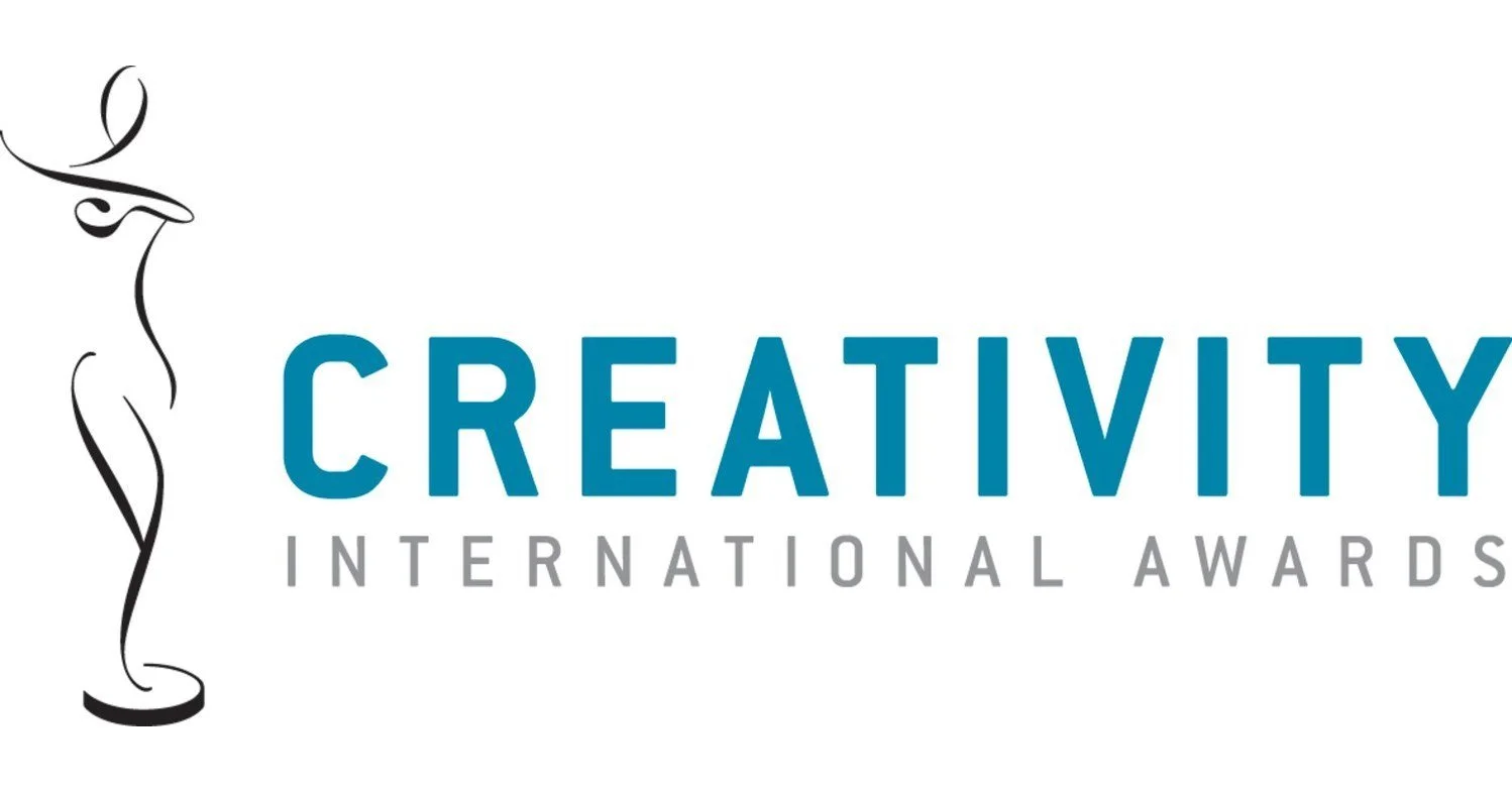 Logo for Creativity International Awards featuring a stylized black and white statue design and bold blue and gray text.