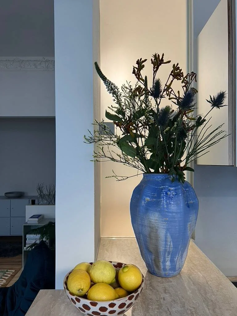 Hand thrown blue vase with flowers. Custom glaze, custom ceramics