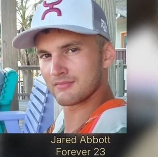 Young man wearing a cap and backpack, outdoors with lounge chairs and palm trees in background, labeled Jared Abbott, Forever 23.