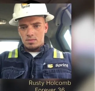 Young man wearing a white construction helmet and navy uniform inside an industrial vehicle, with text indicating his name and age.