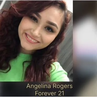 Close-up selfie of a young woman with long, wavy hair, smiling, wearing a green top. Text overlay says 'Angelina Rogers Forever 21'.