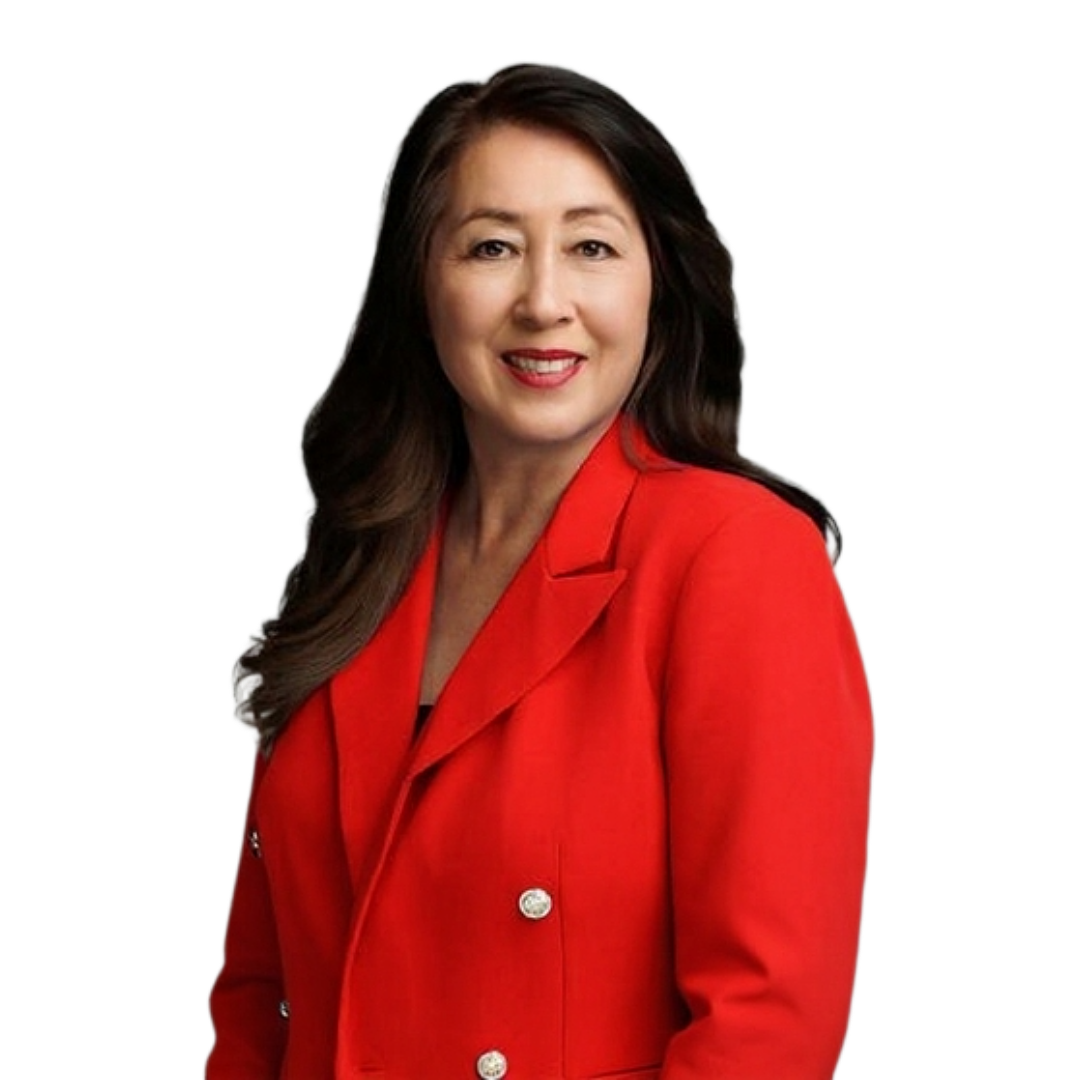 Professionally dressed  Carol Pefley with long brown hair wearing a red blazer, smiling.