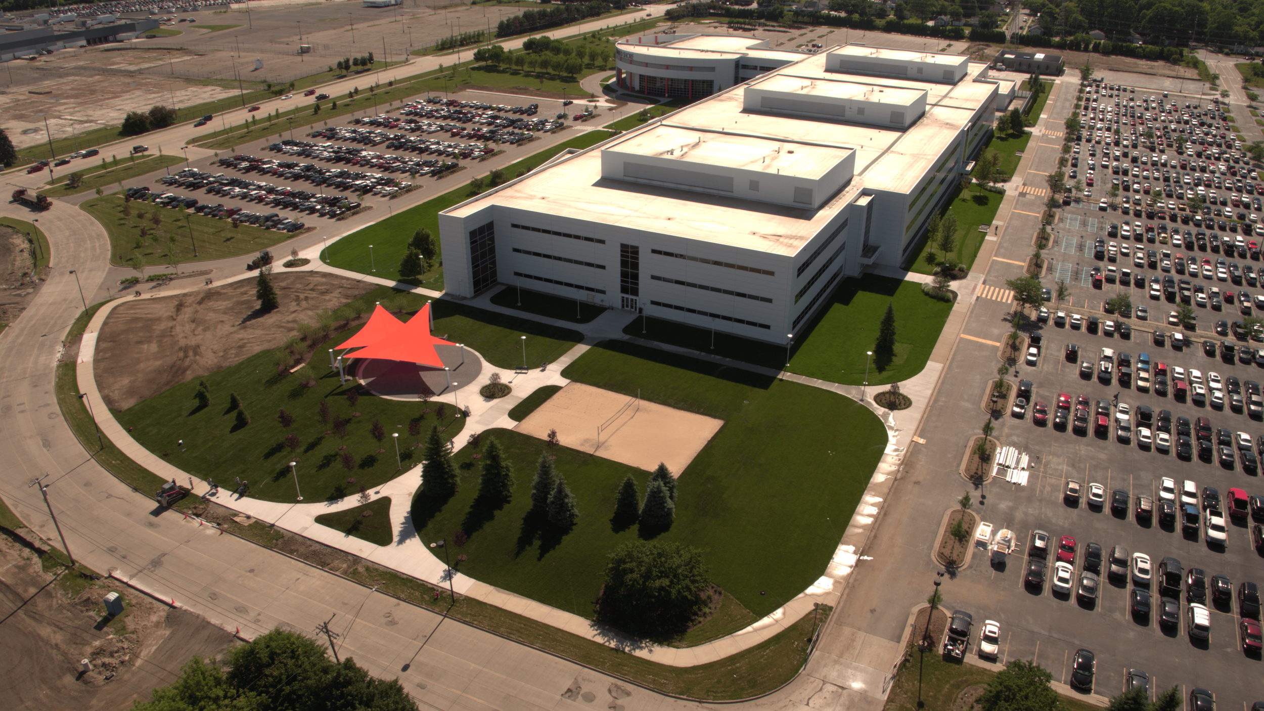 Aerial view of a large modern building with commercial sod installation in the process in Pontiac, Michigan.