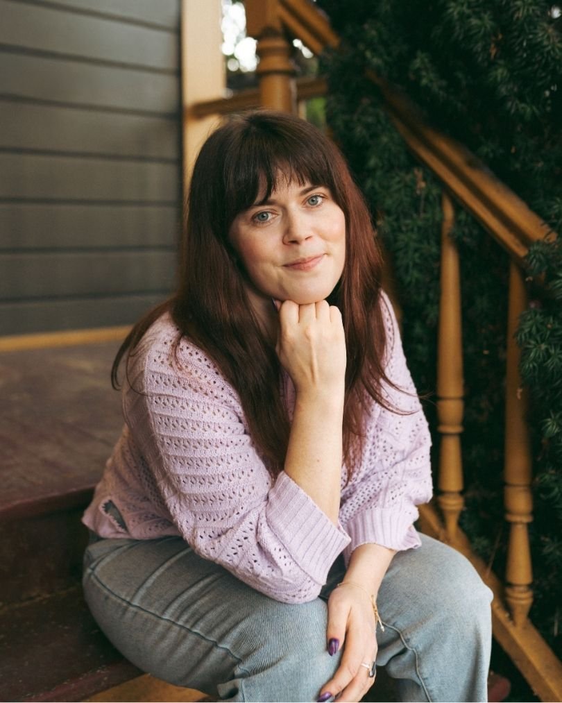 Tori Gormon, a witchcraft and spiritual therapist in Orgeon, sitting on porch