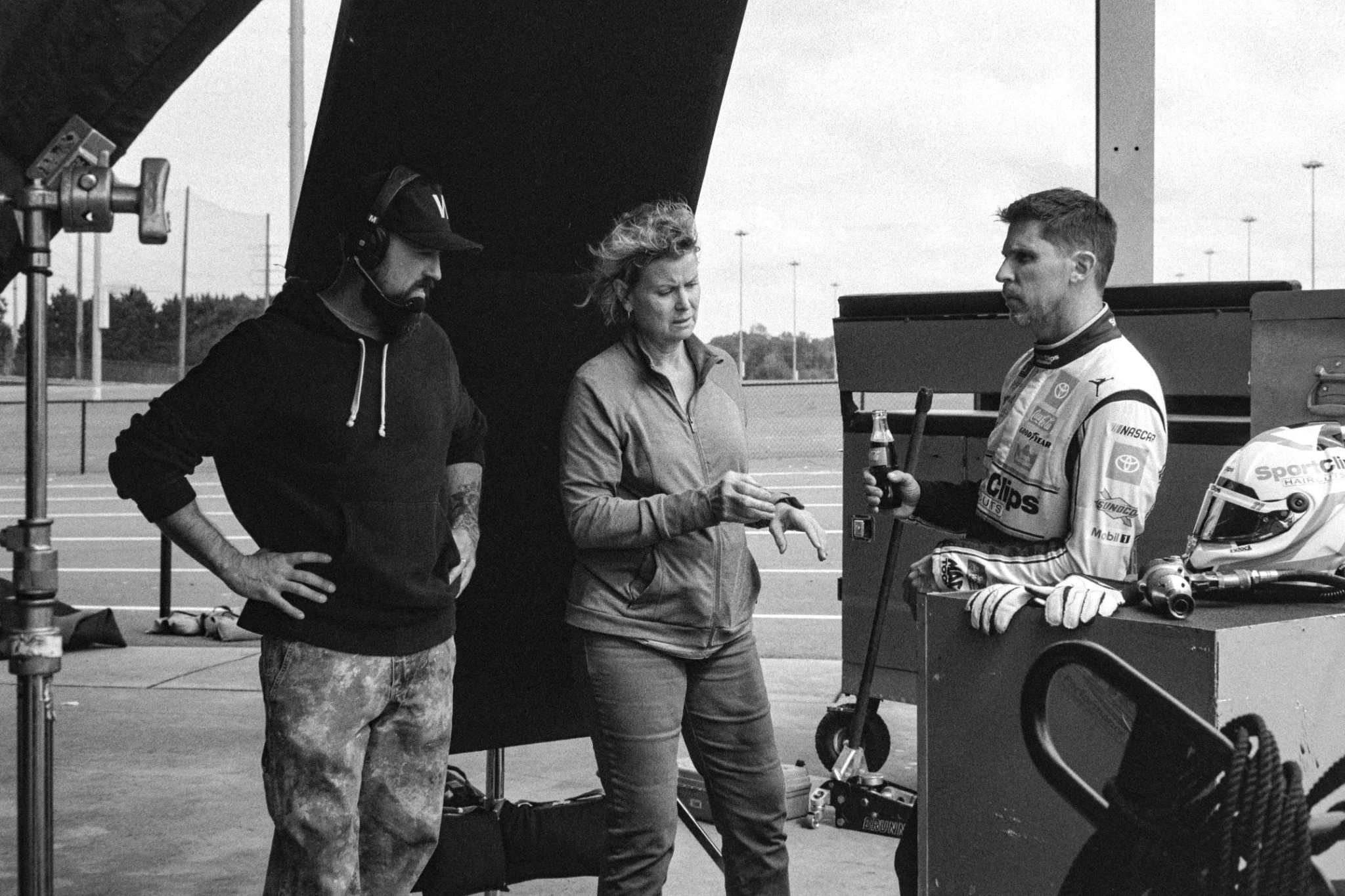black and white BTS 2026 Nascar x coca-cola x hales photo jason and crew member with denny hamlin