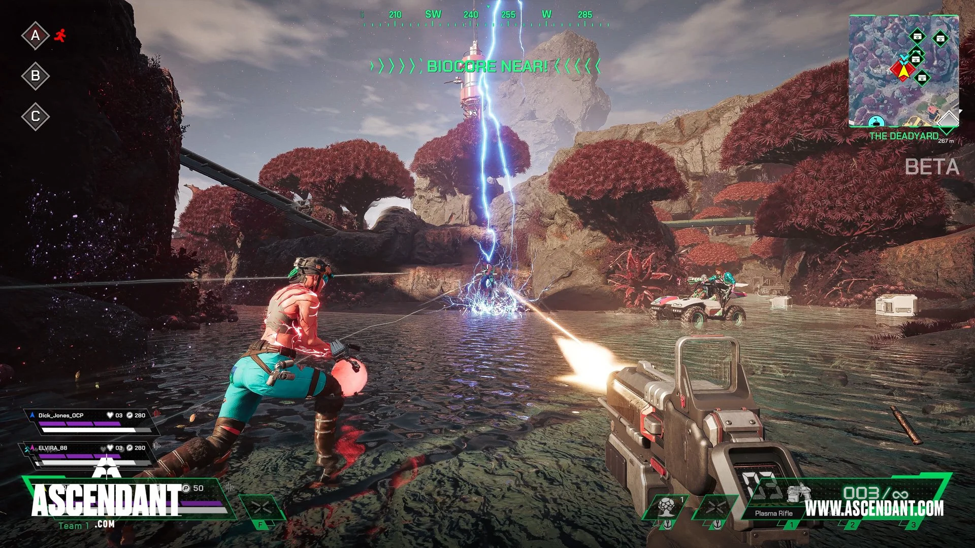 Video game screenshot showing characters engaged in combat near a lake, firing energy weapons at a lightning storm and a large floating biocore labeled 'BIOCORE NEAR'. The environment is natural with red-leaf trees and rocky terrain, with a mini-map and game interface visible.