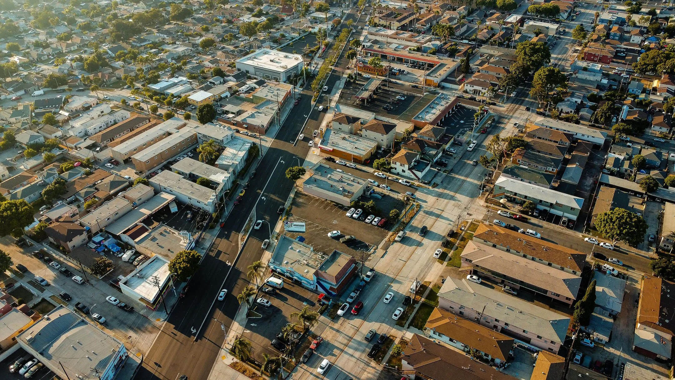 Aerial sunset view of a Southwest LA neighborhood undergoing infill development.