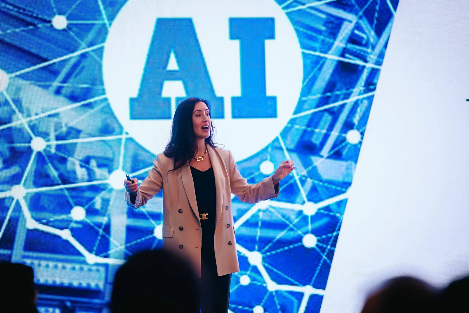 Erica Orange delivering a keynote on stage