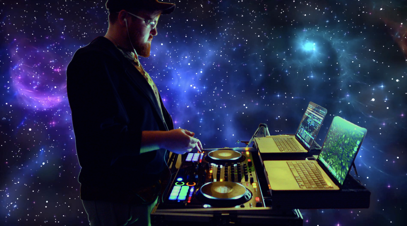 A person DJing with laptops and a music controller against a backdrop of a starry galaxy