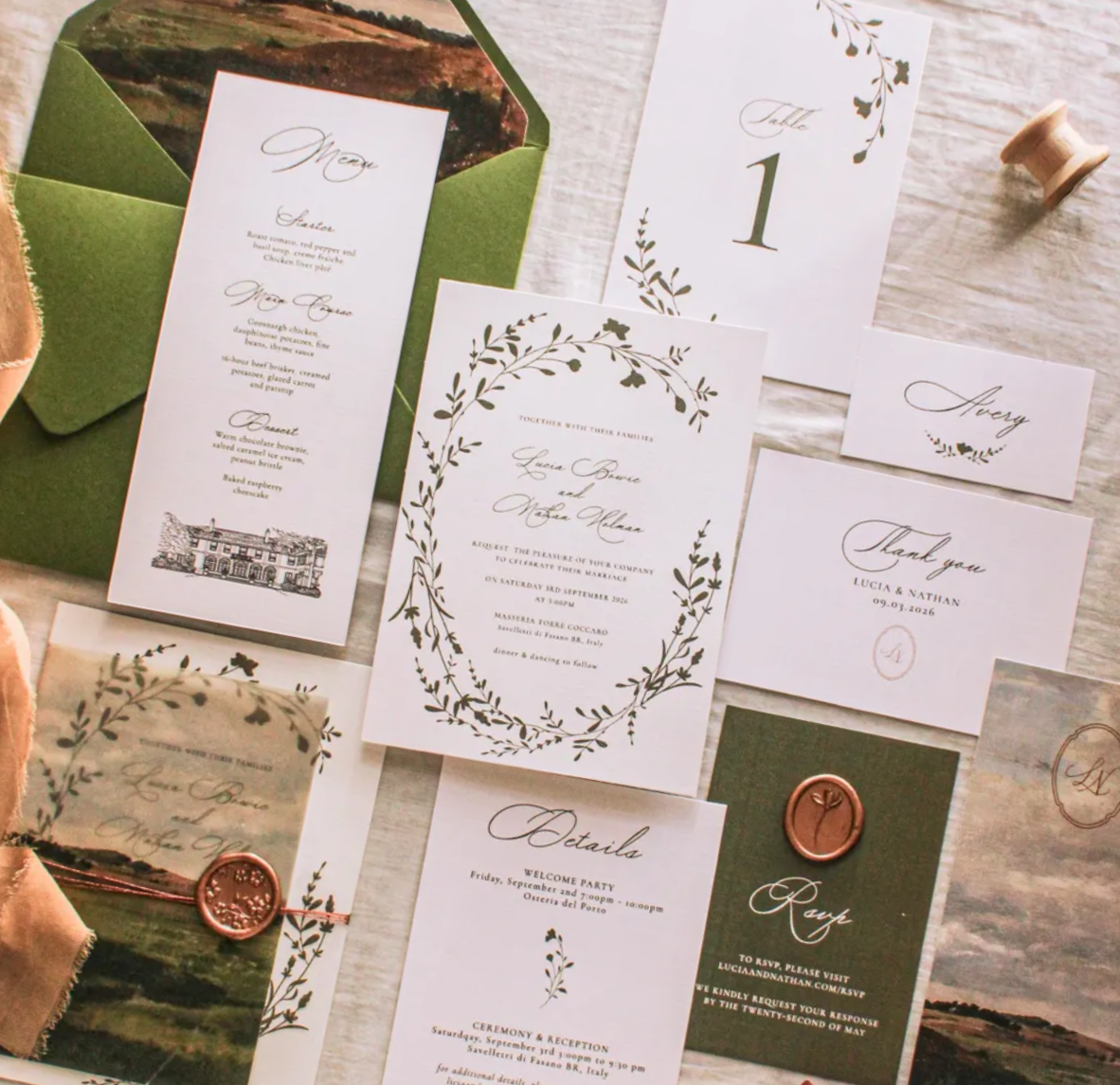 Luxury custom wedding invitation suite with coordinated stationery, event signage, and envelope design.