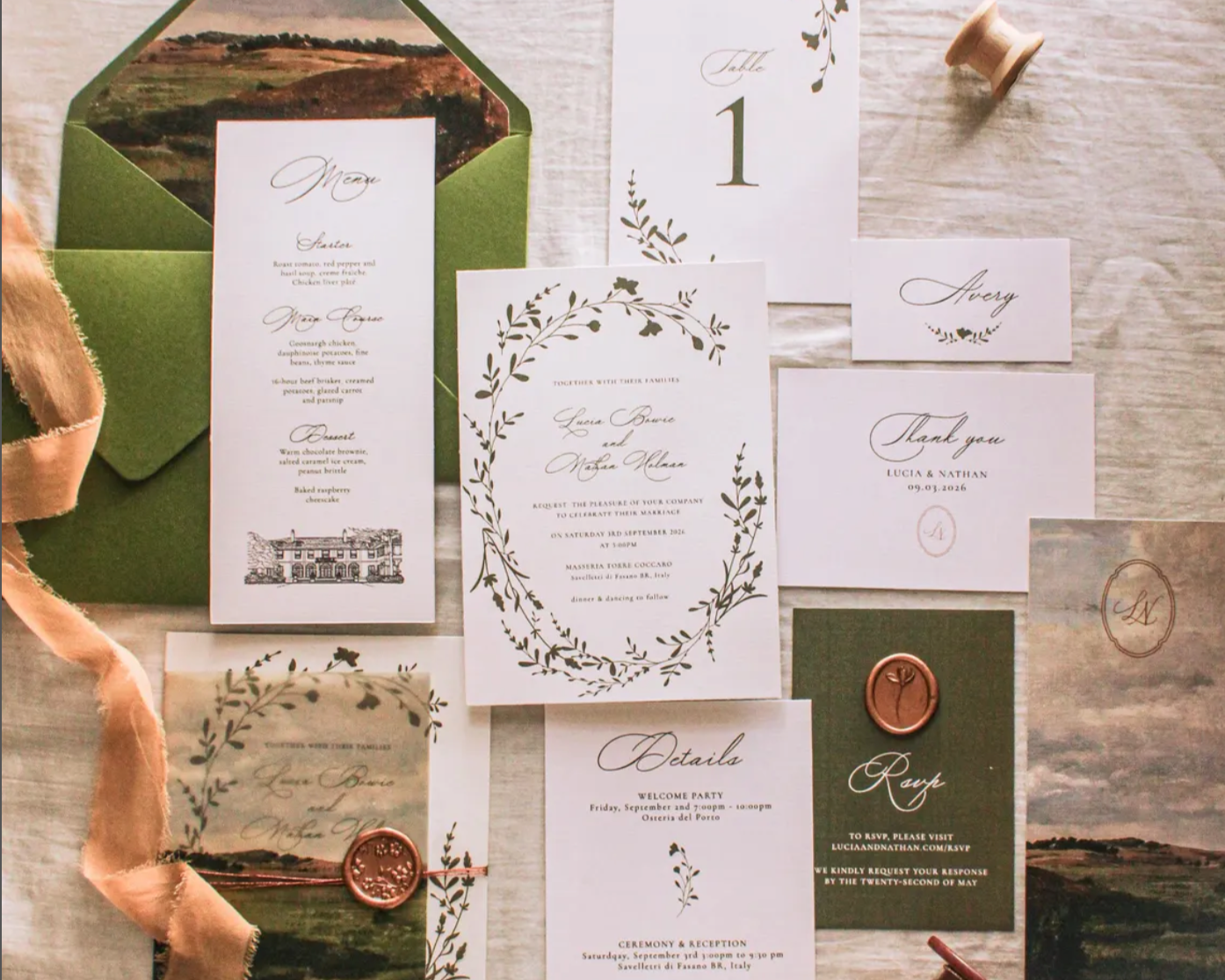 Luxury custom wedding invitation suite with coordinated stationery, event signage, and envelope design.