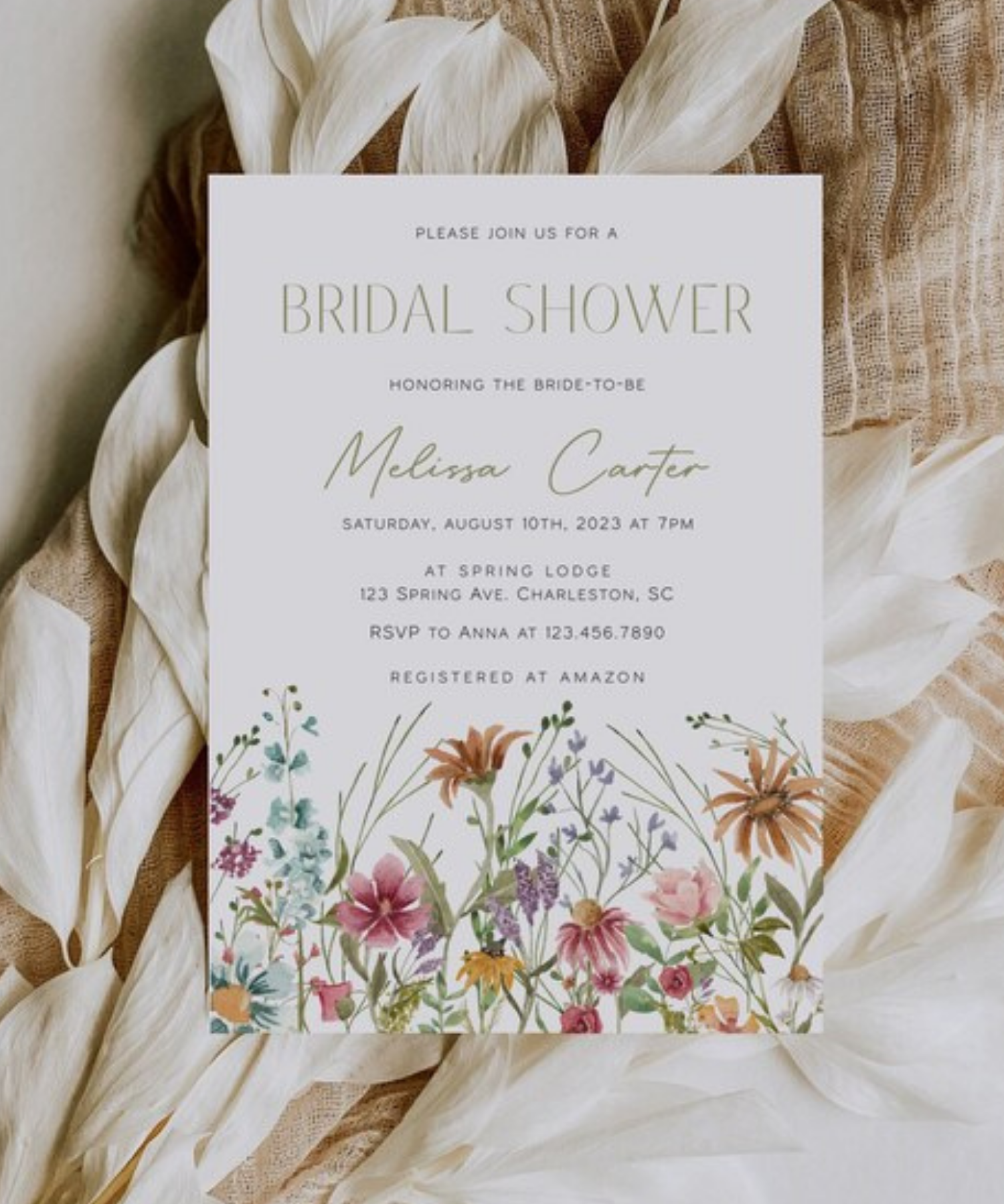 Elegant bridal shower invitation with soft floral illustration and neutral color palette.