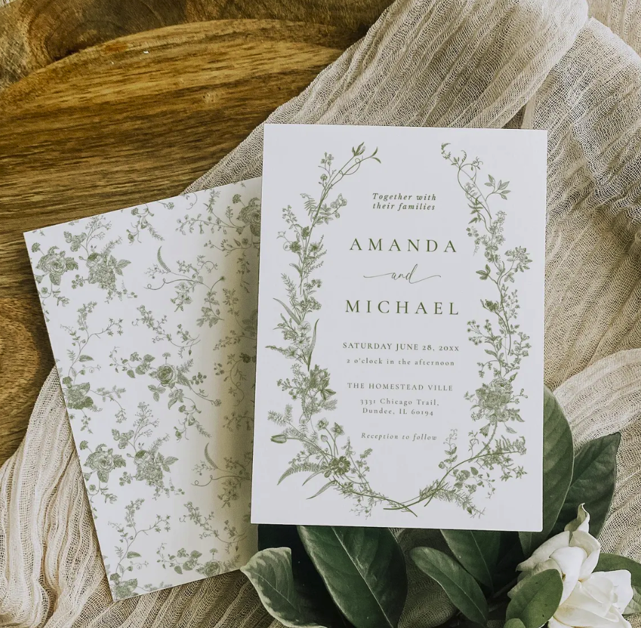 Elegant custom wedding invitation design with botanical greenery and soft neutral tones created by Celebrate & Send.
