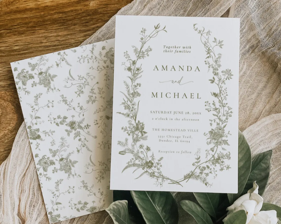 Elegant custom wedding invitation design with botanical greenery and soft neutral tones created by Celebrate & Send.