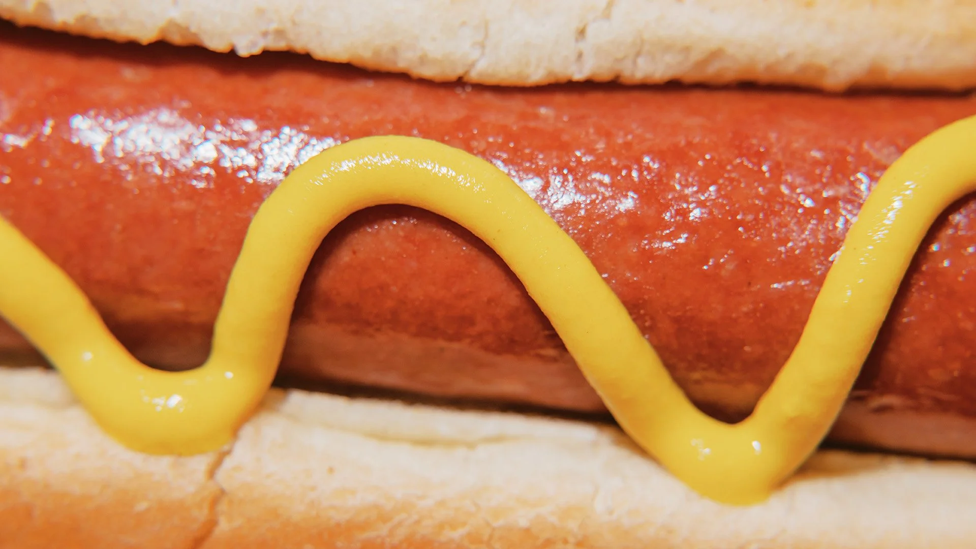 hot dog with mustard