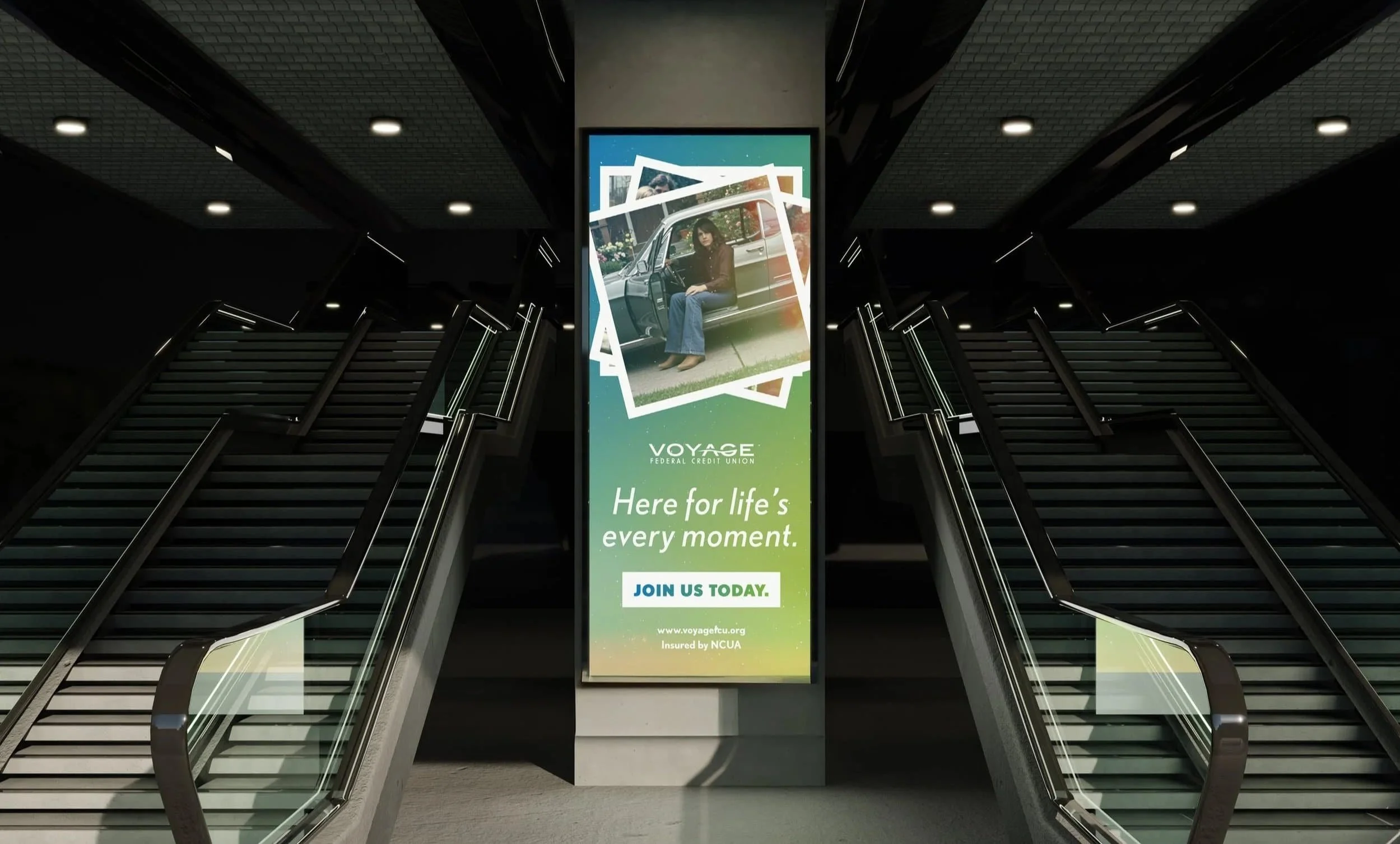 A Voyage vertical billboard with placement between two sets of stairs.