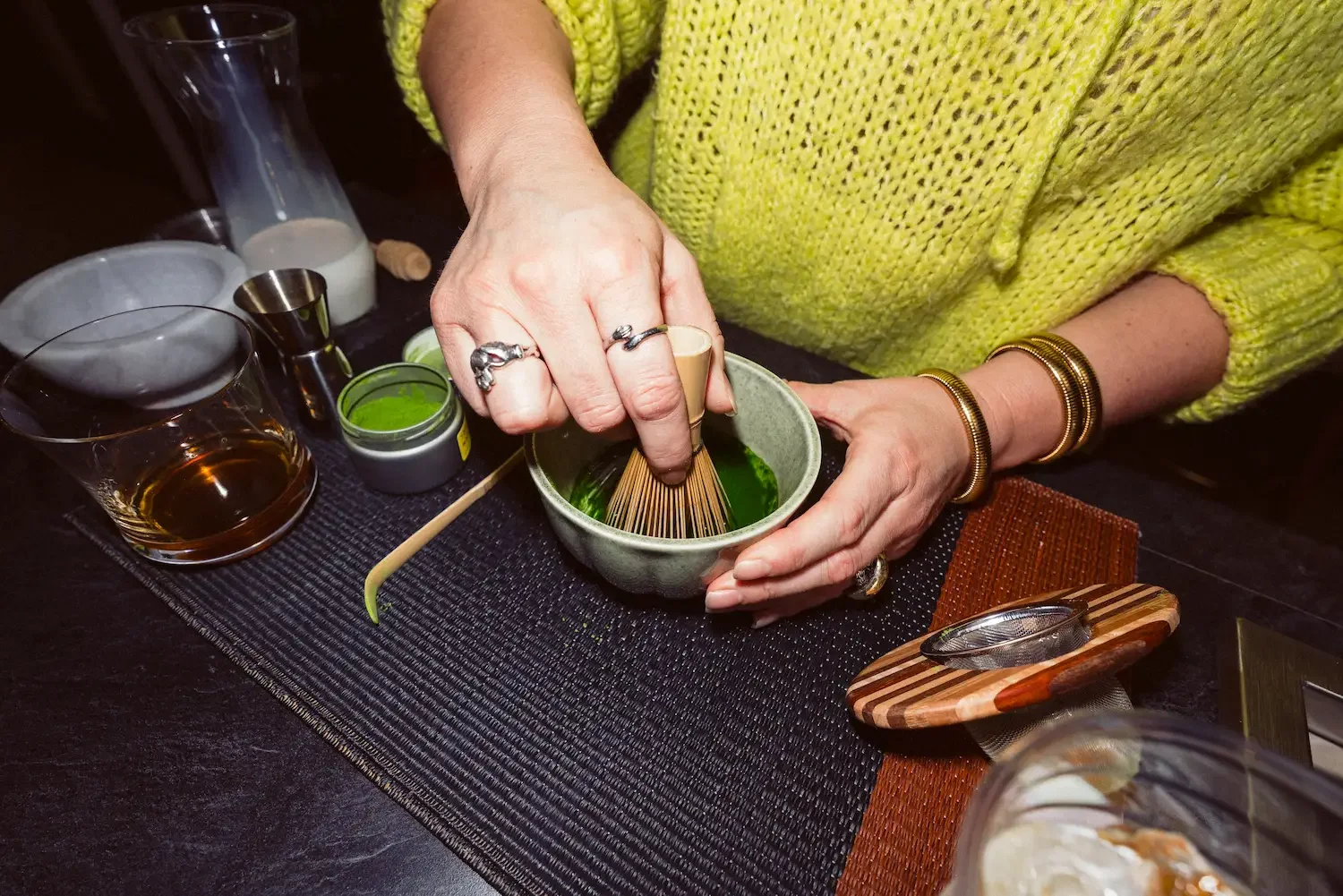 Picture of woman whisking matcha.