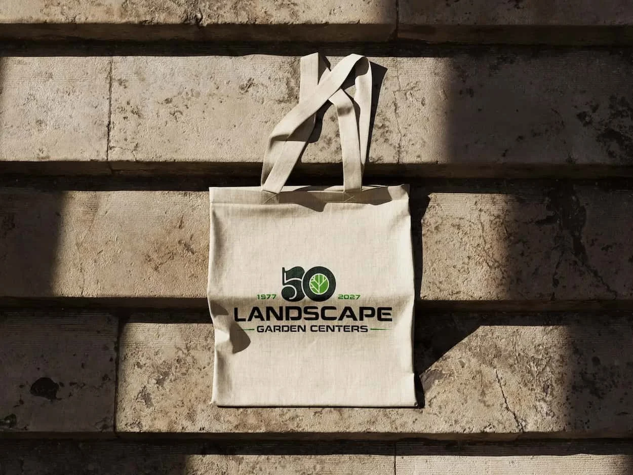 Landscape Garden's 50th anniversary branded tote bad lying on a staircase