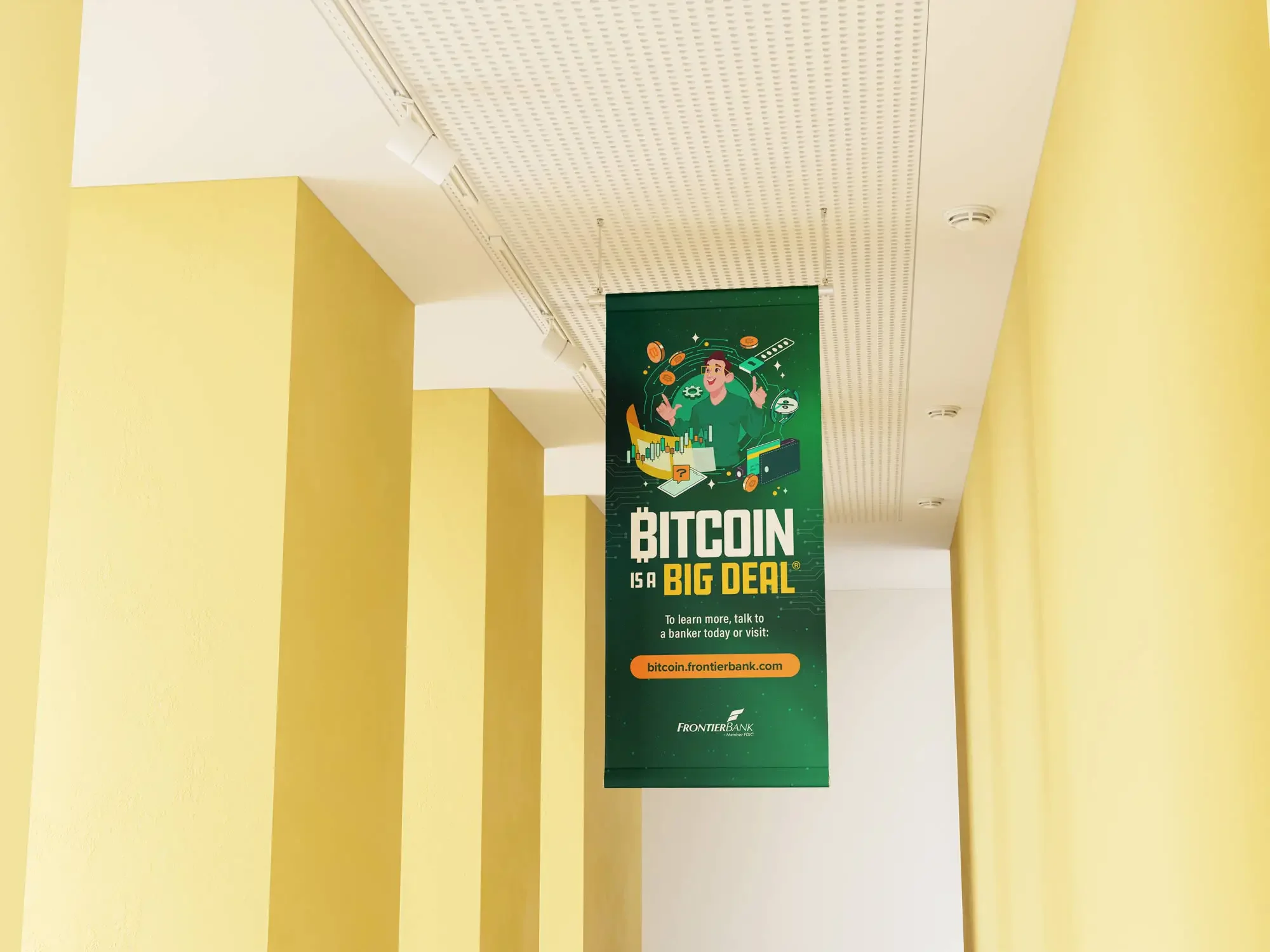 Frontier Bank Bitcoin is a Big Deal campaign in branch hanging banner designed by The Sampson House.