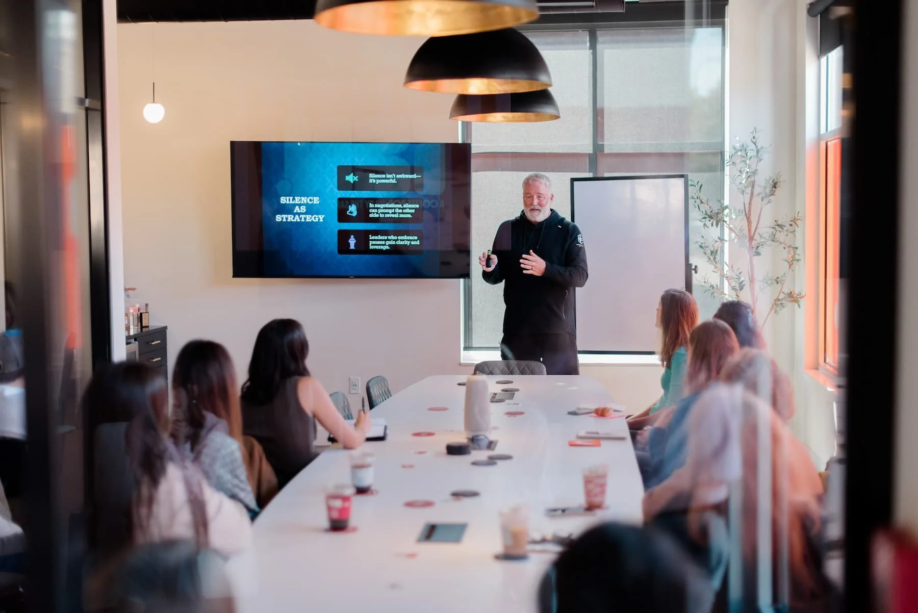 Jon Carda giving a talk to a group of people.