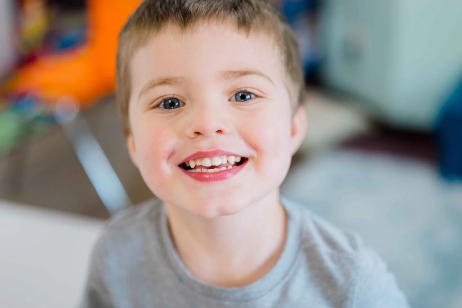 young boy smiling at the camera.