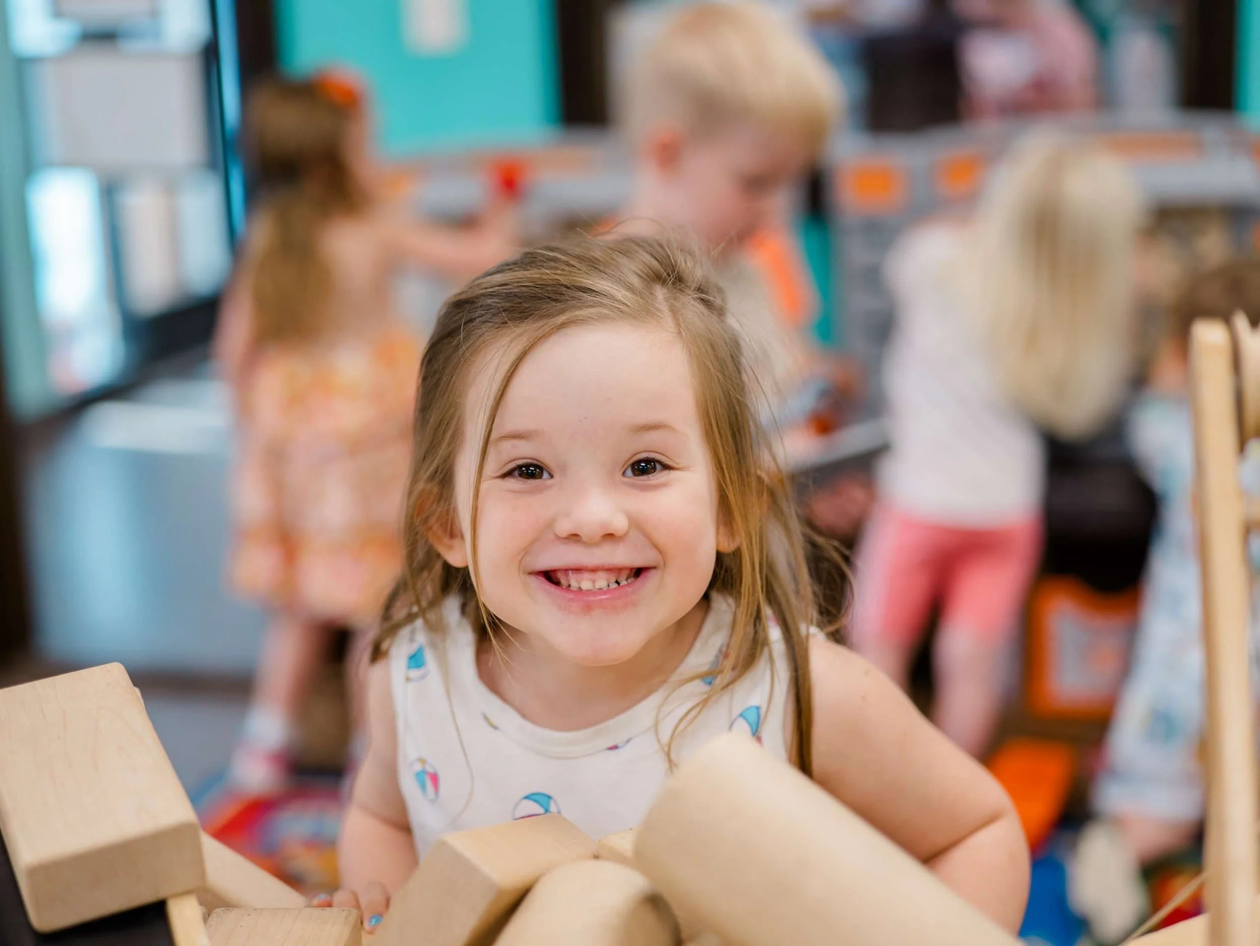 young girl smiling at the camera.