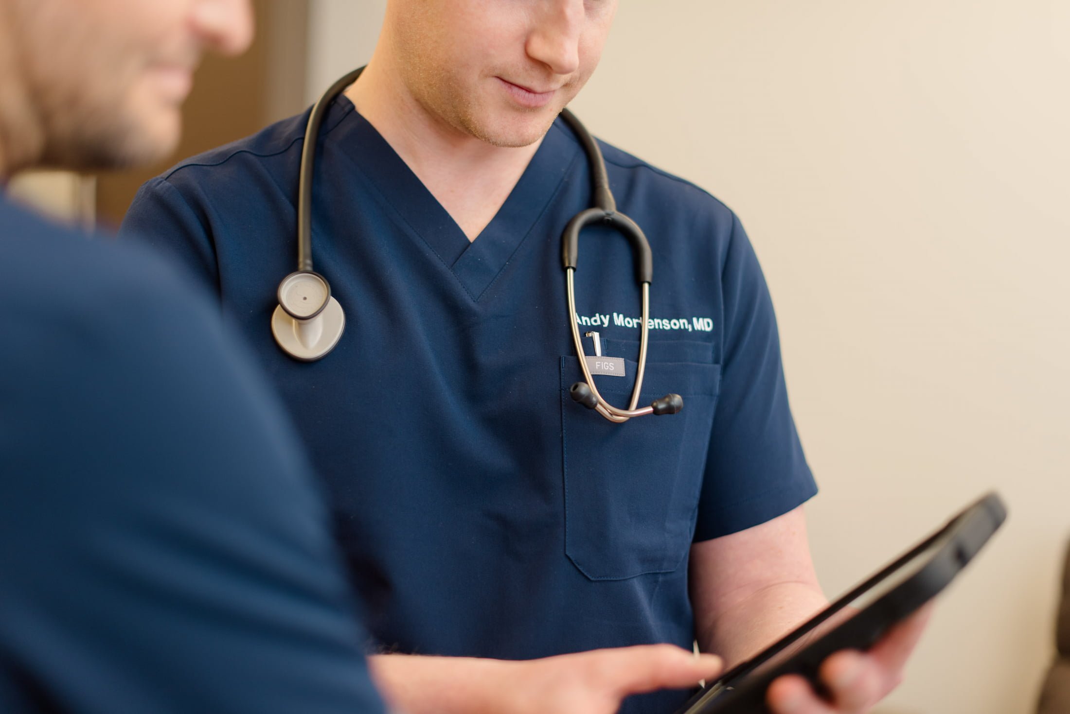 PAX Institute doctors looking at screen.