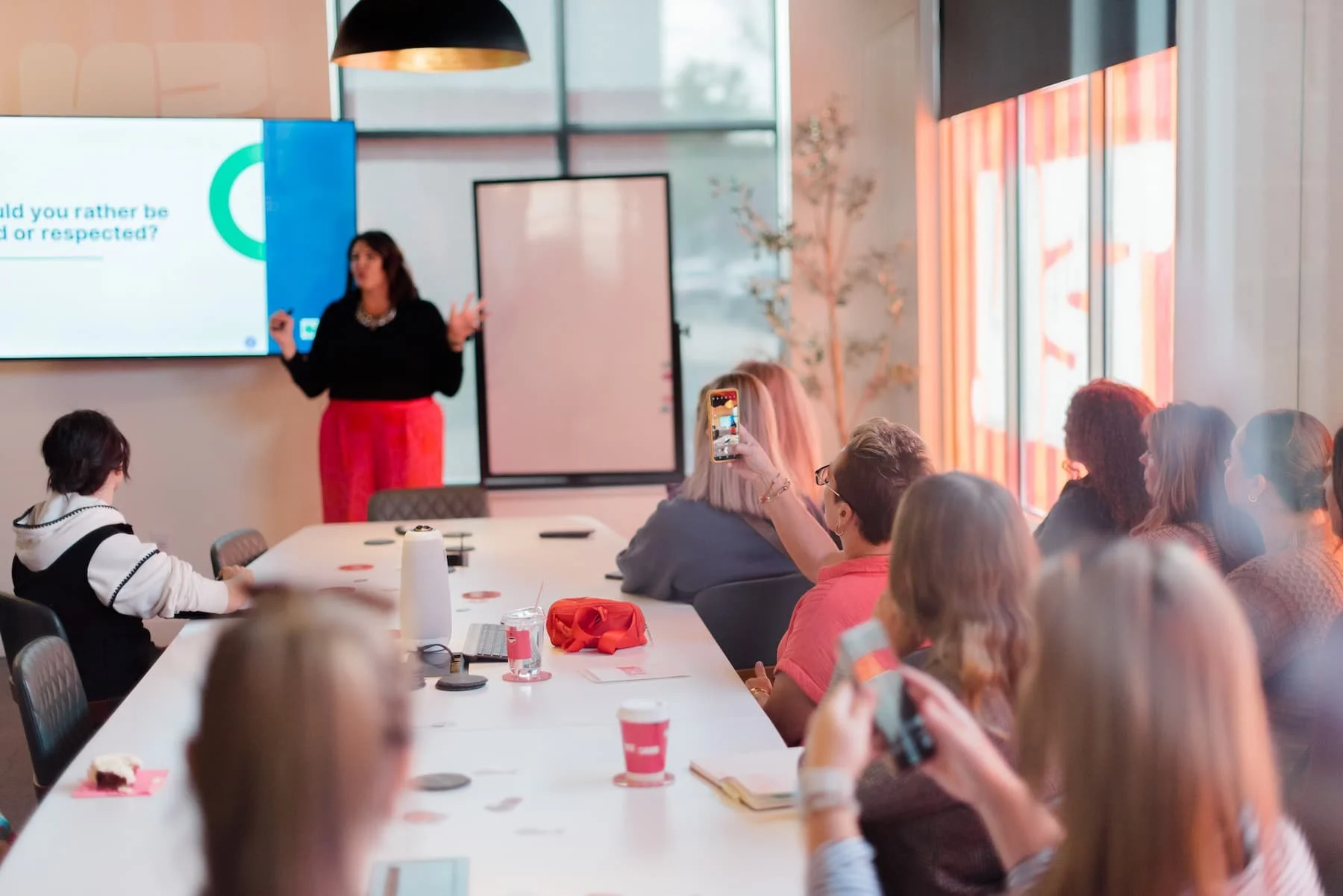 Jenna Harris giving a talk to a group of people.
