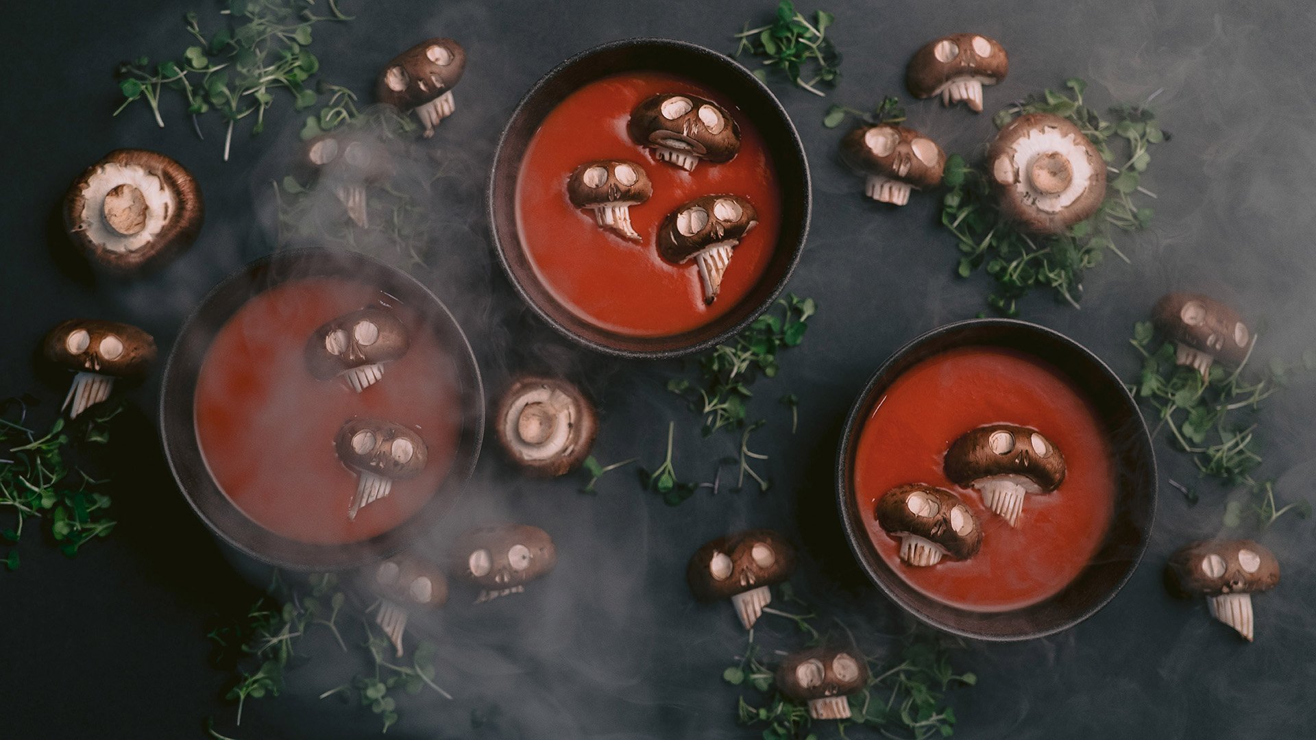 Tomato soup with mushroom skulls floating in the soup