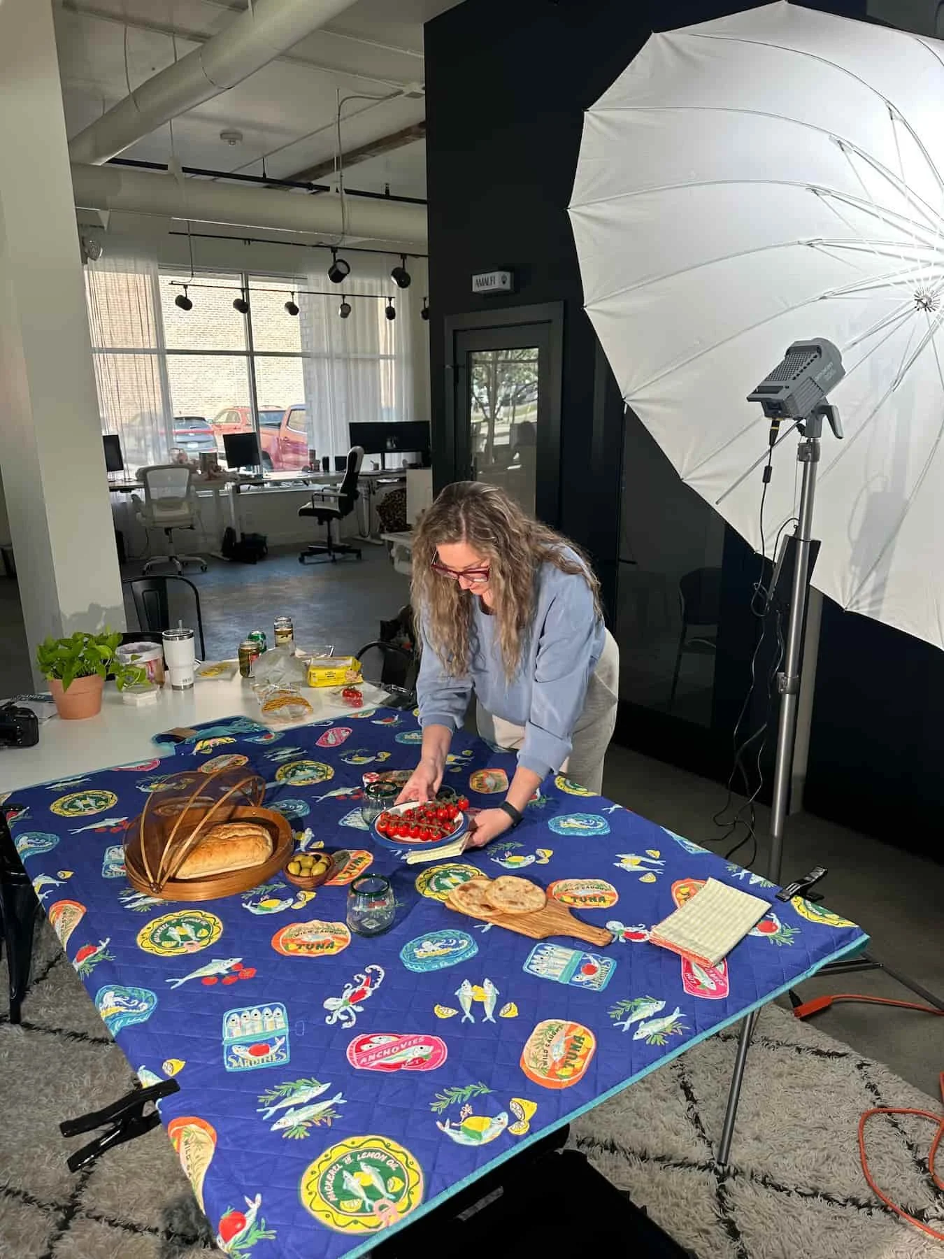 A Sampson House team member staging a photoshoot.