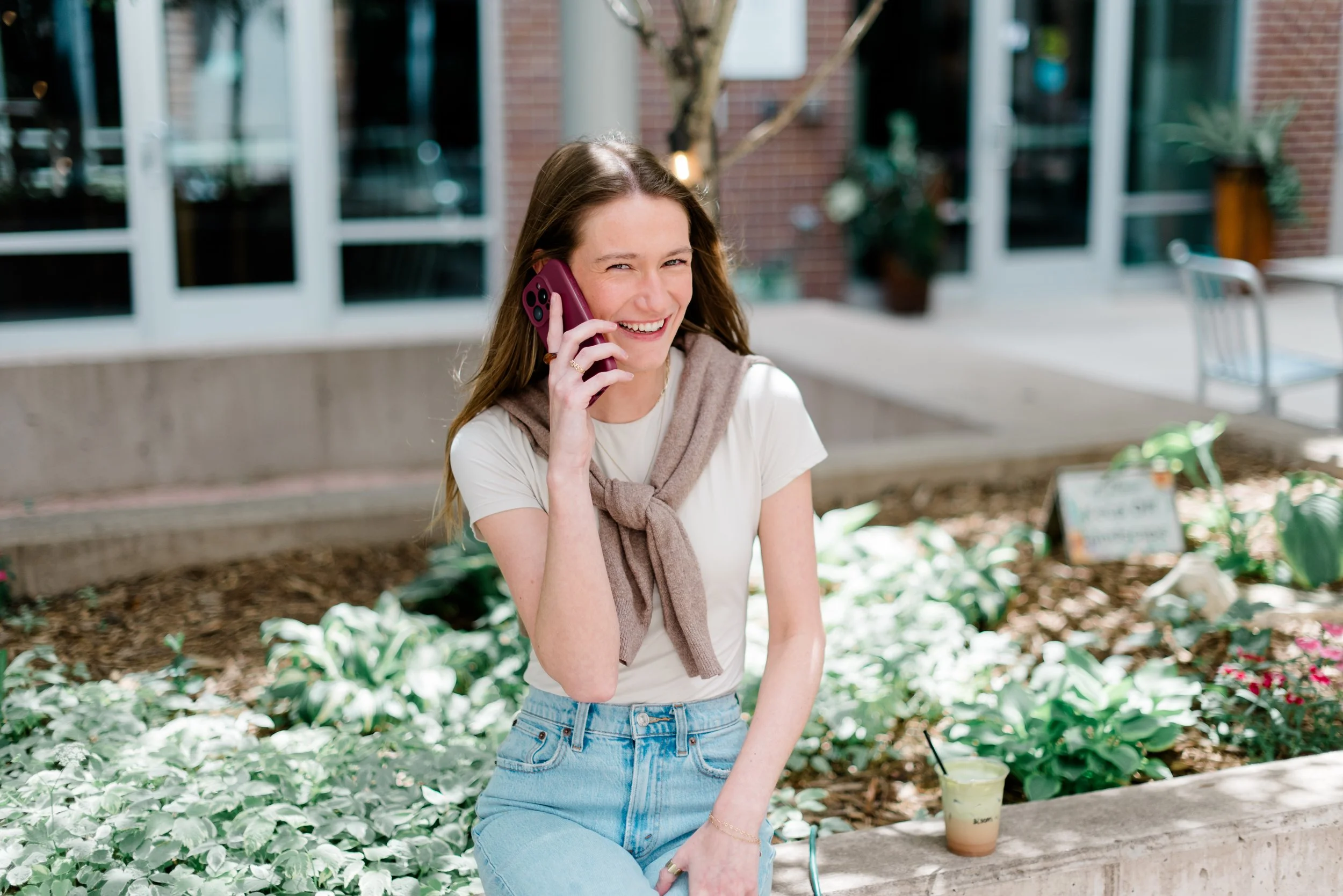 Emily Arteman on the phone smiling