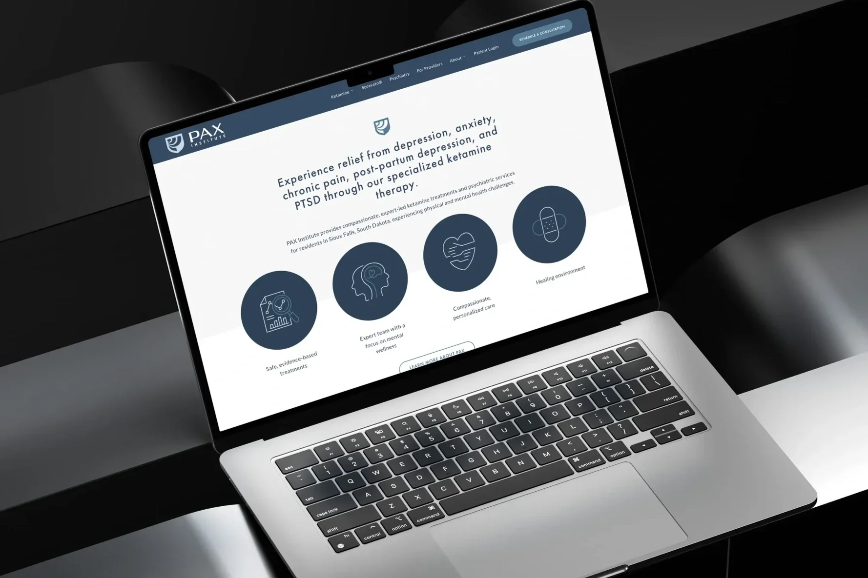 A laptop showing a website