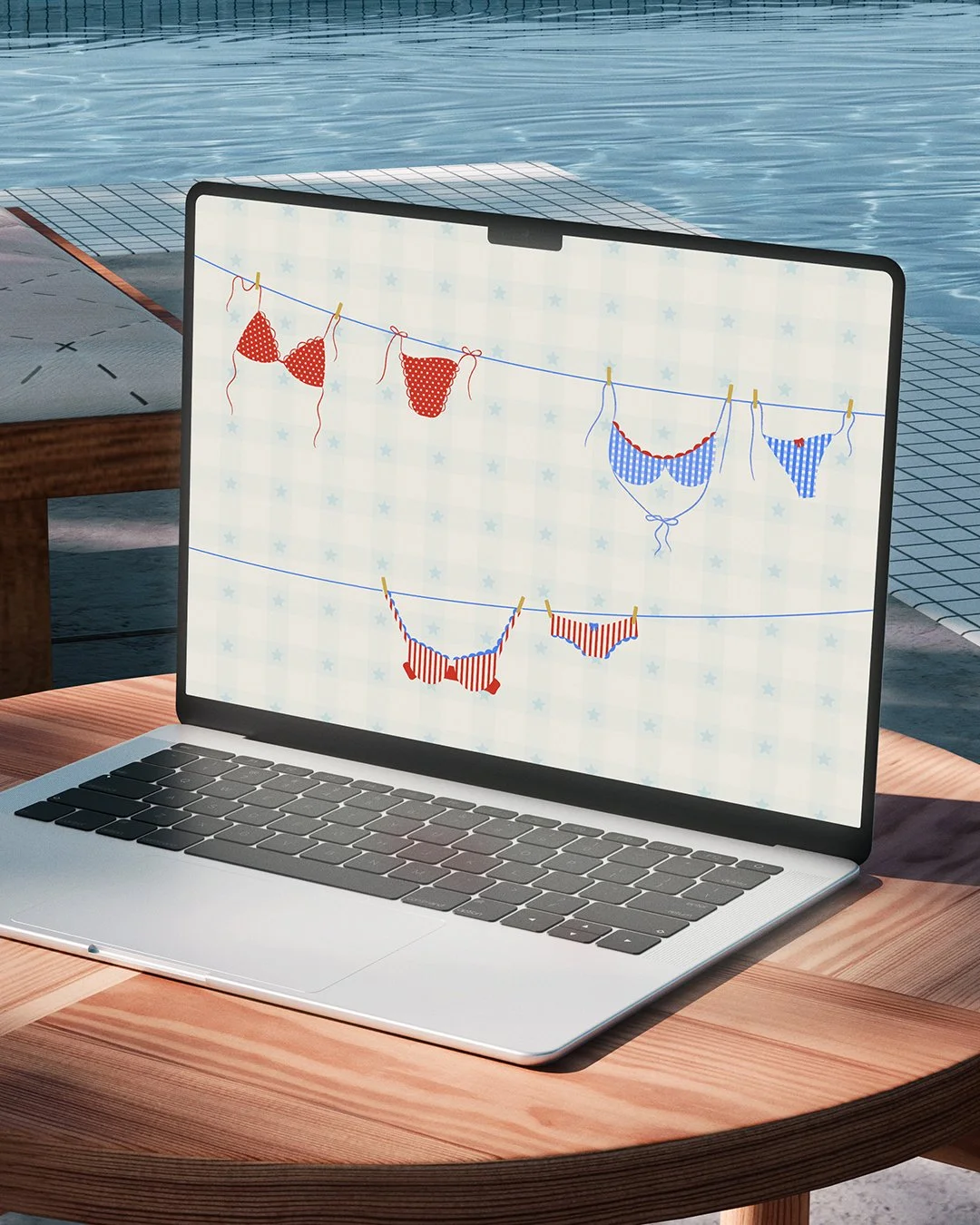 Computer by the pool with July desktop calendar