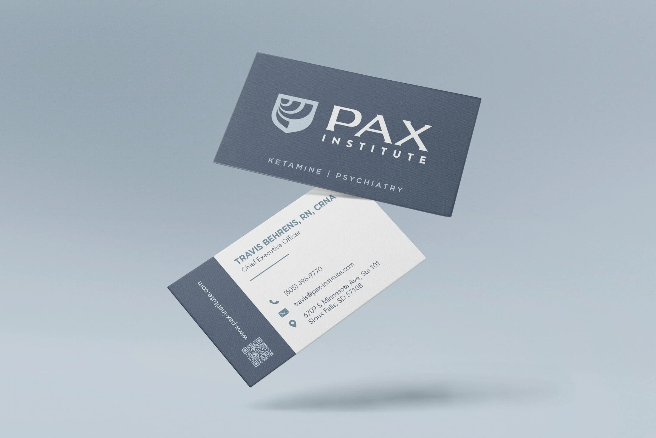 PAX Institute floating business cards mockup