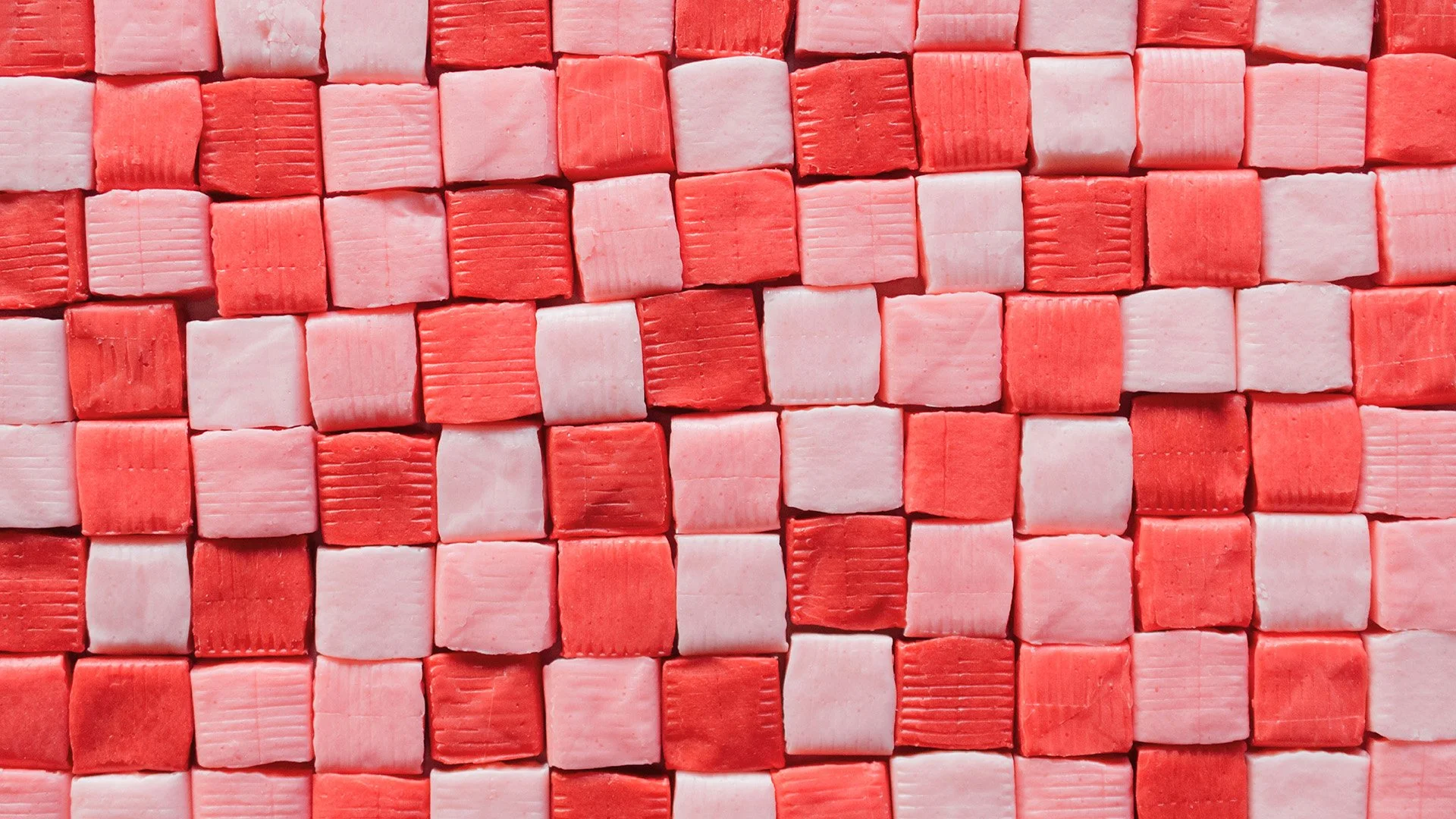 A grid of red and pink starbursts.