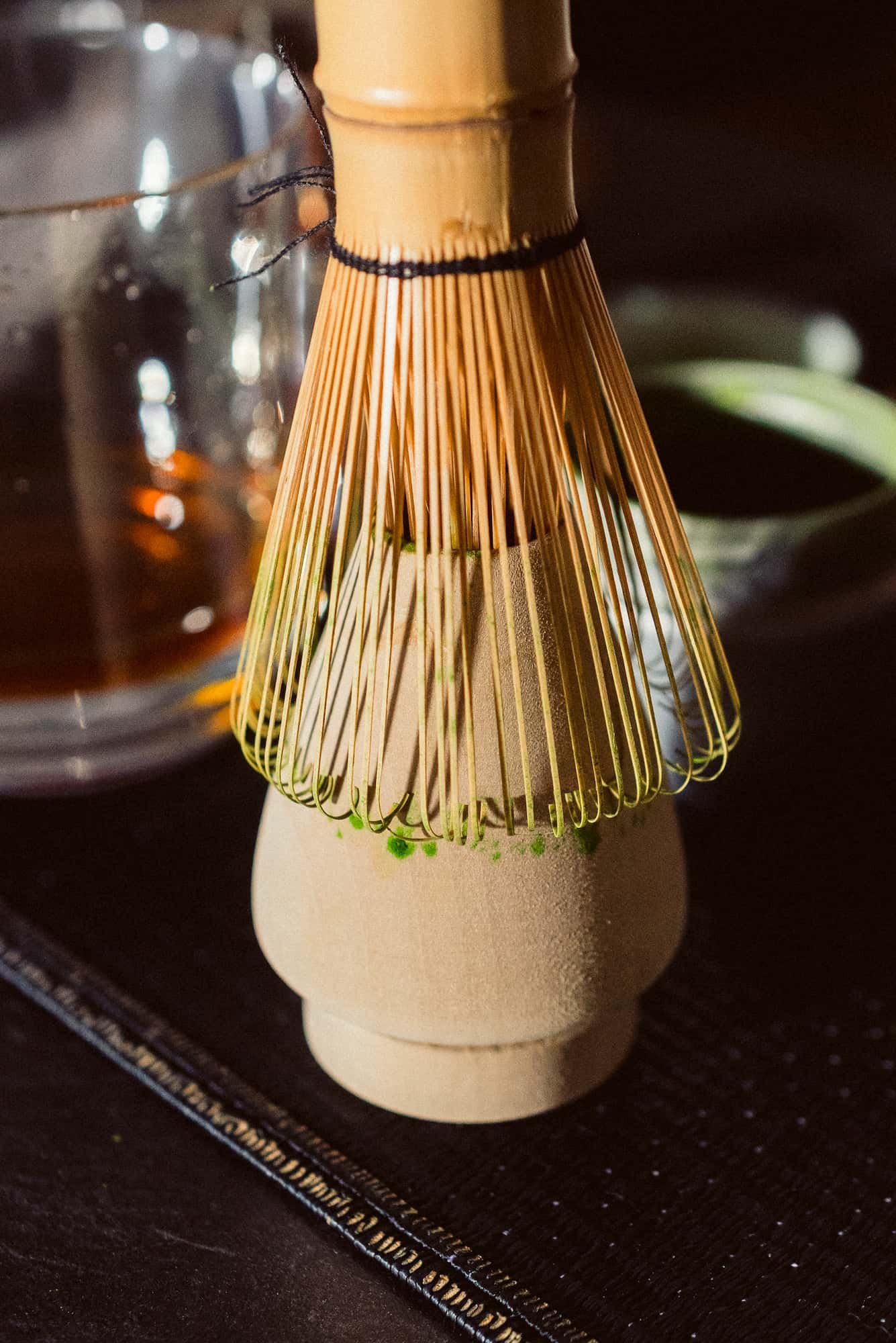 Matcha whisk on stand.