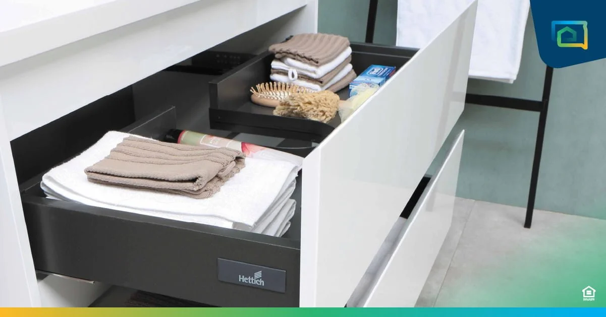Dresser cupboard open with clothes folded neatly