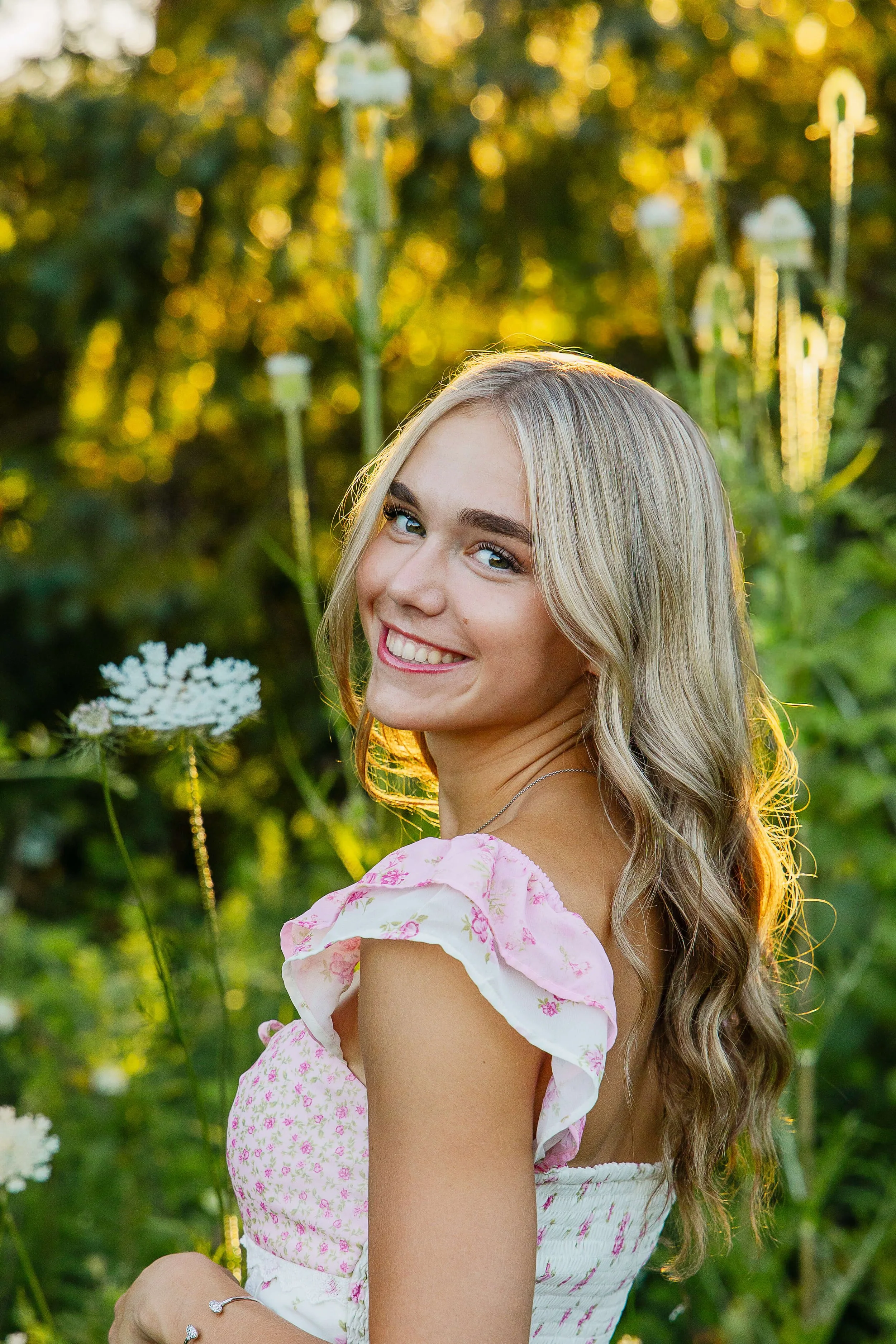 High School senior girl looking over her shoulder with a close up headshot