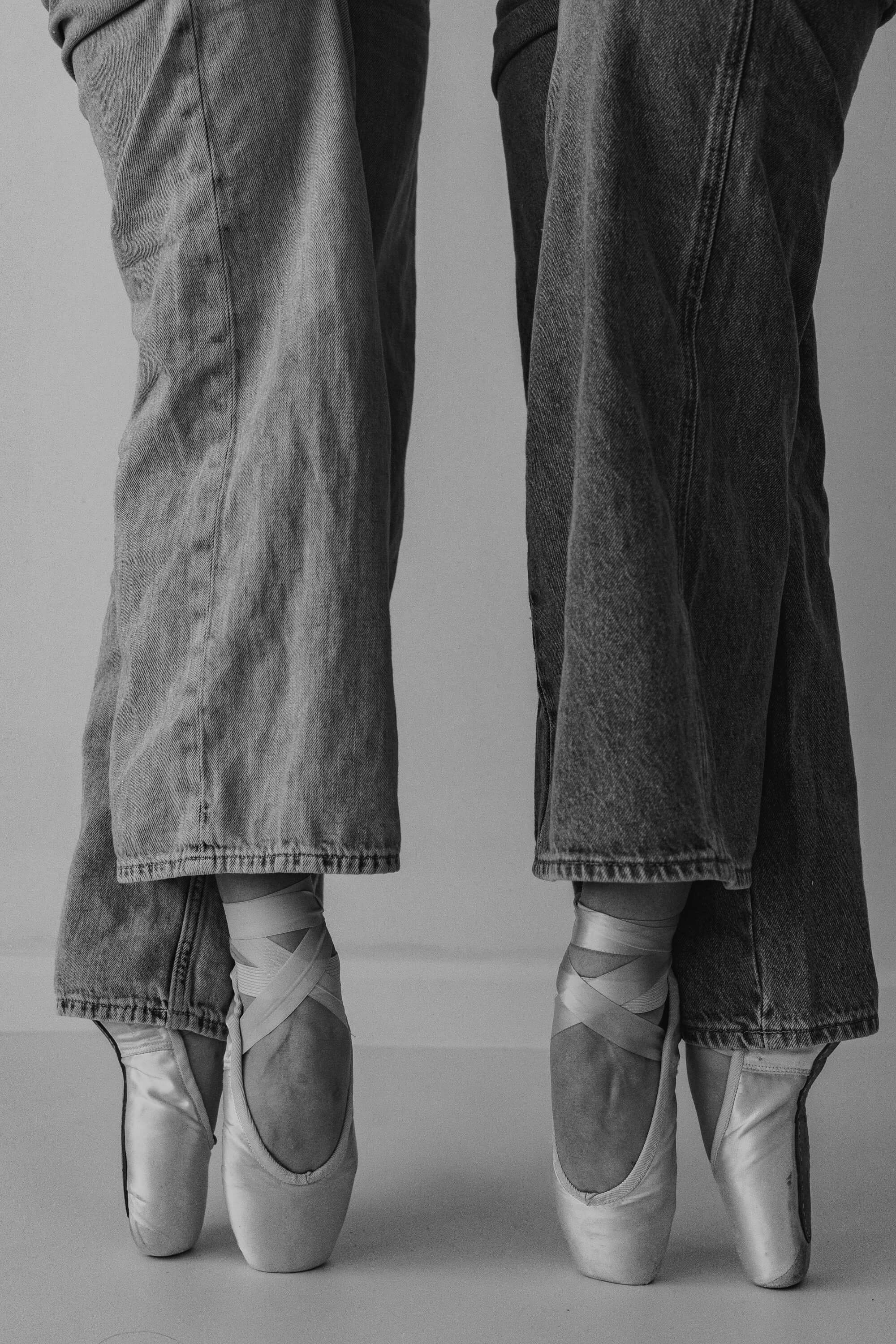 A black and white portrait of pointe shoes.