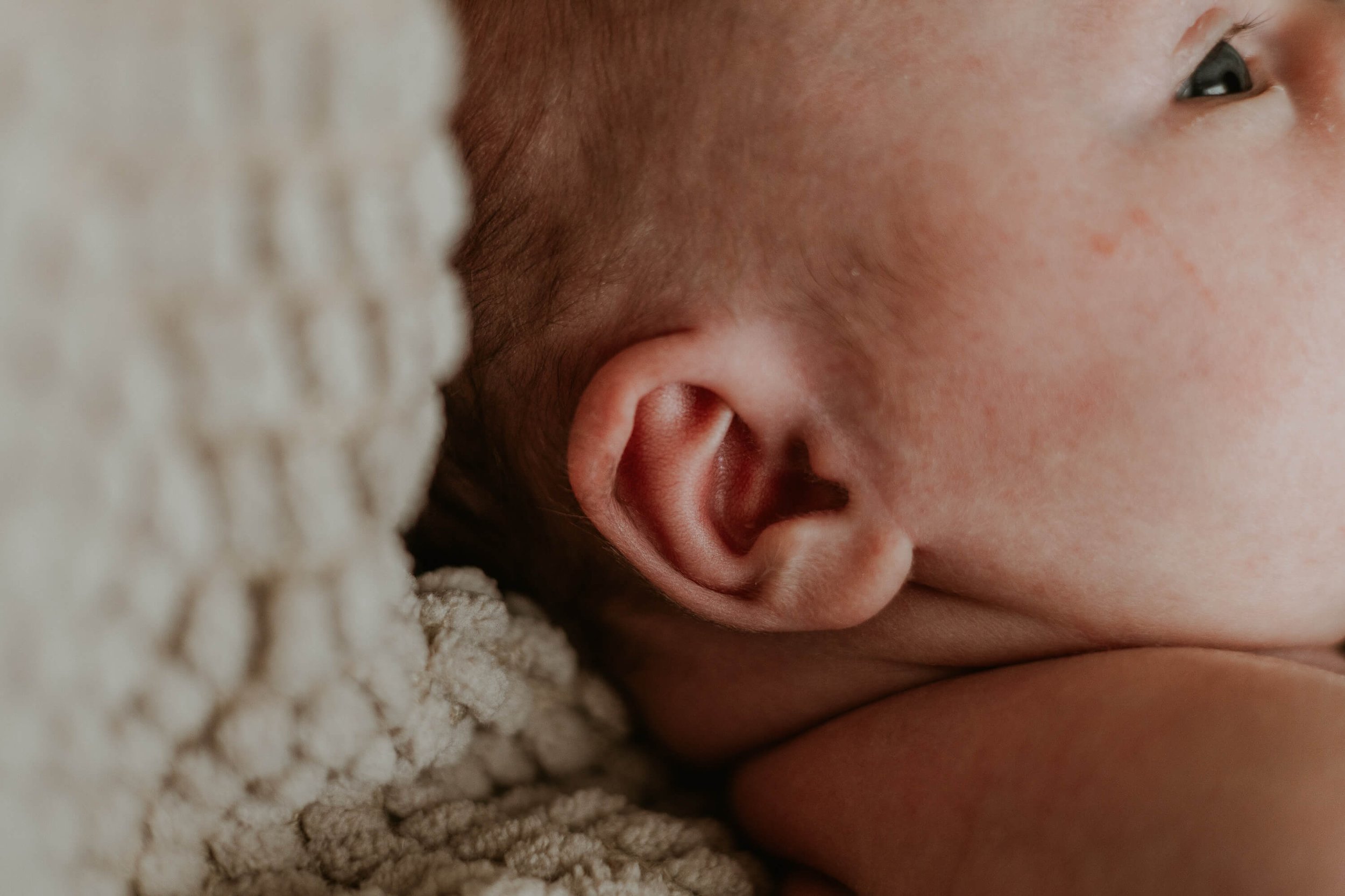 The ear of a baby boy named Cal