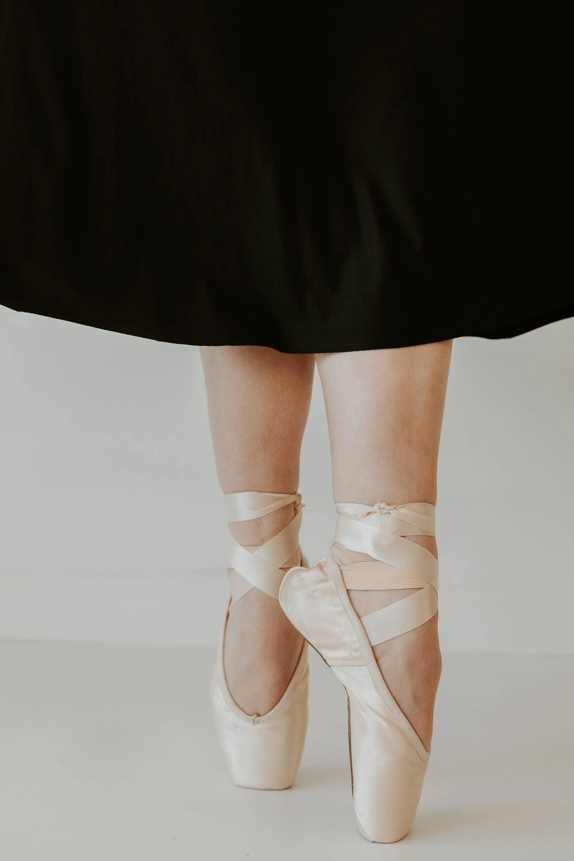 A close up of a dancer's feet en pointe.