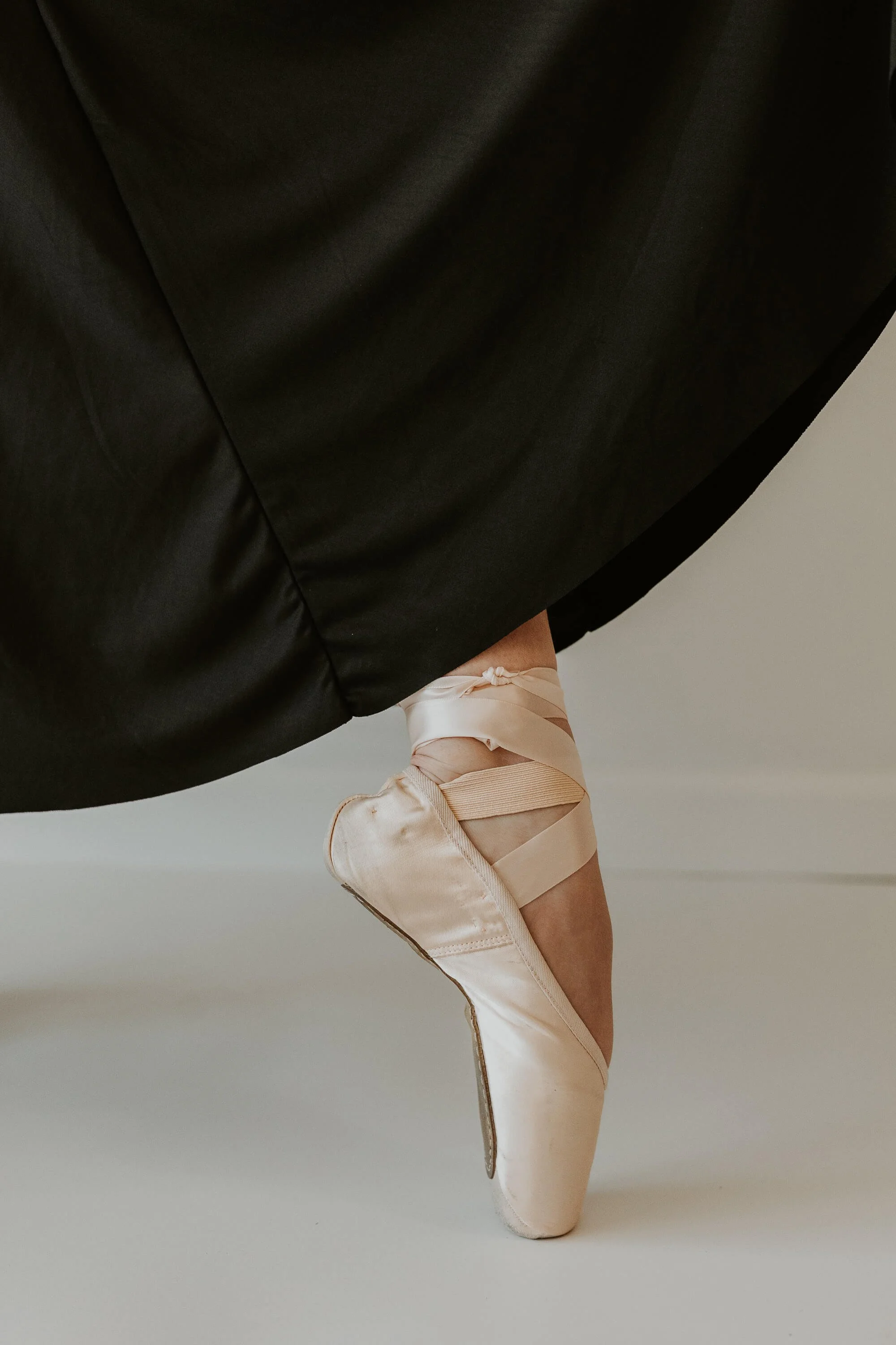A close up of the profile of a pointe shoe.