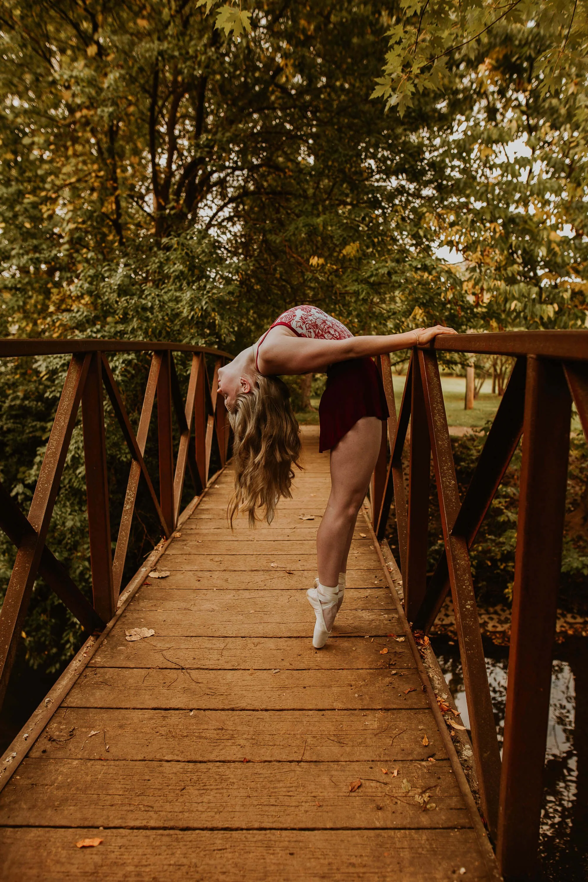 A dancer shows her flexibility as she bends backwards