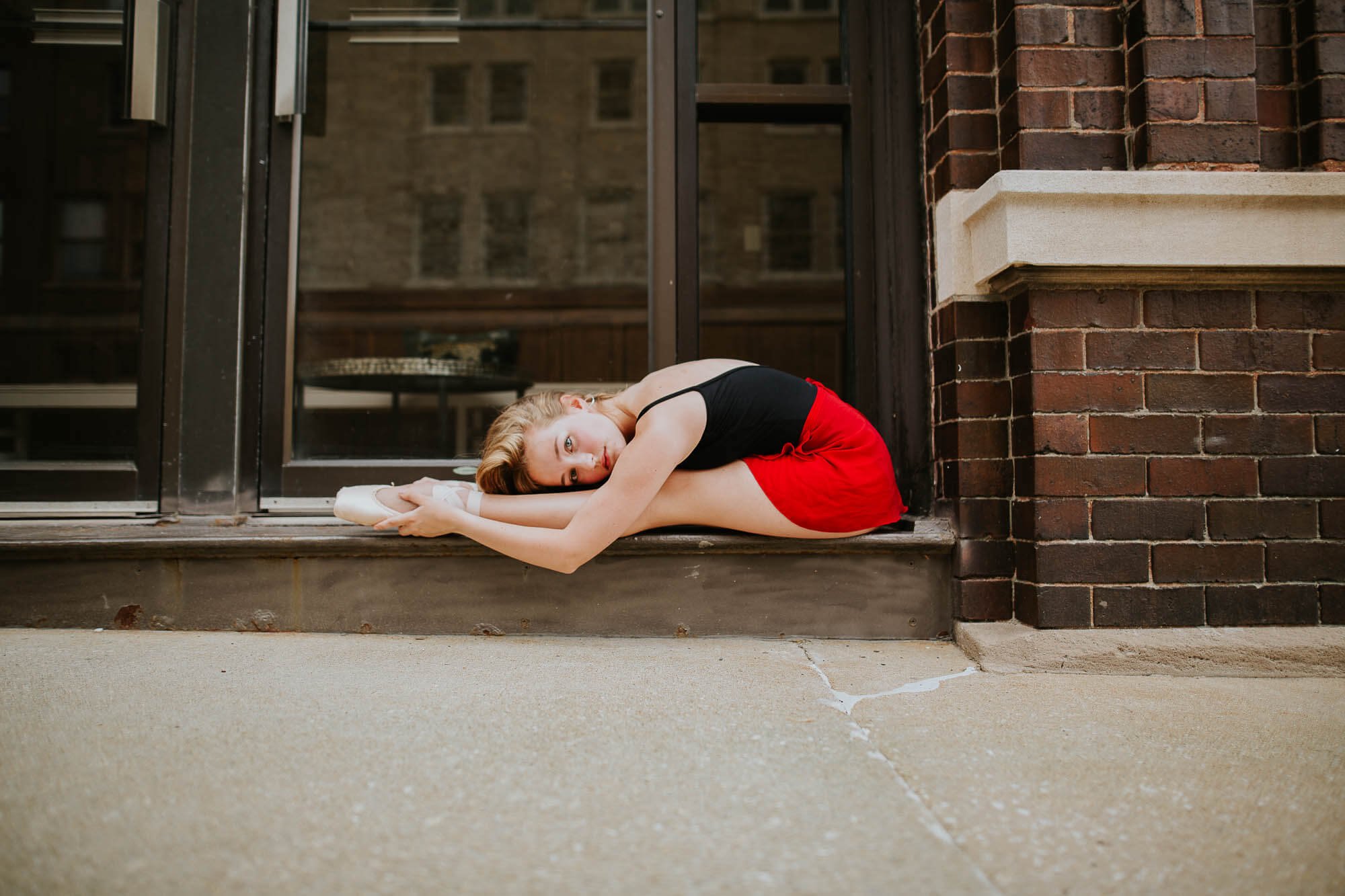 A ballerina holds a stretch demonstrating her incredible flexibility