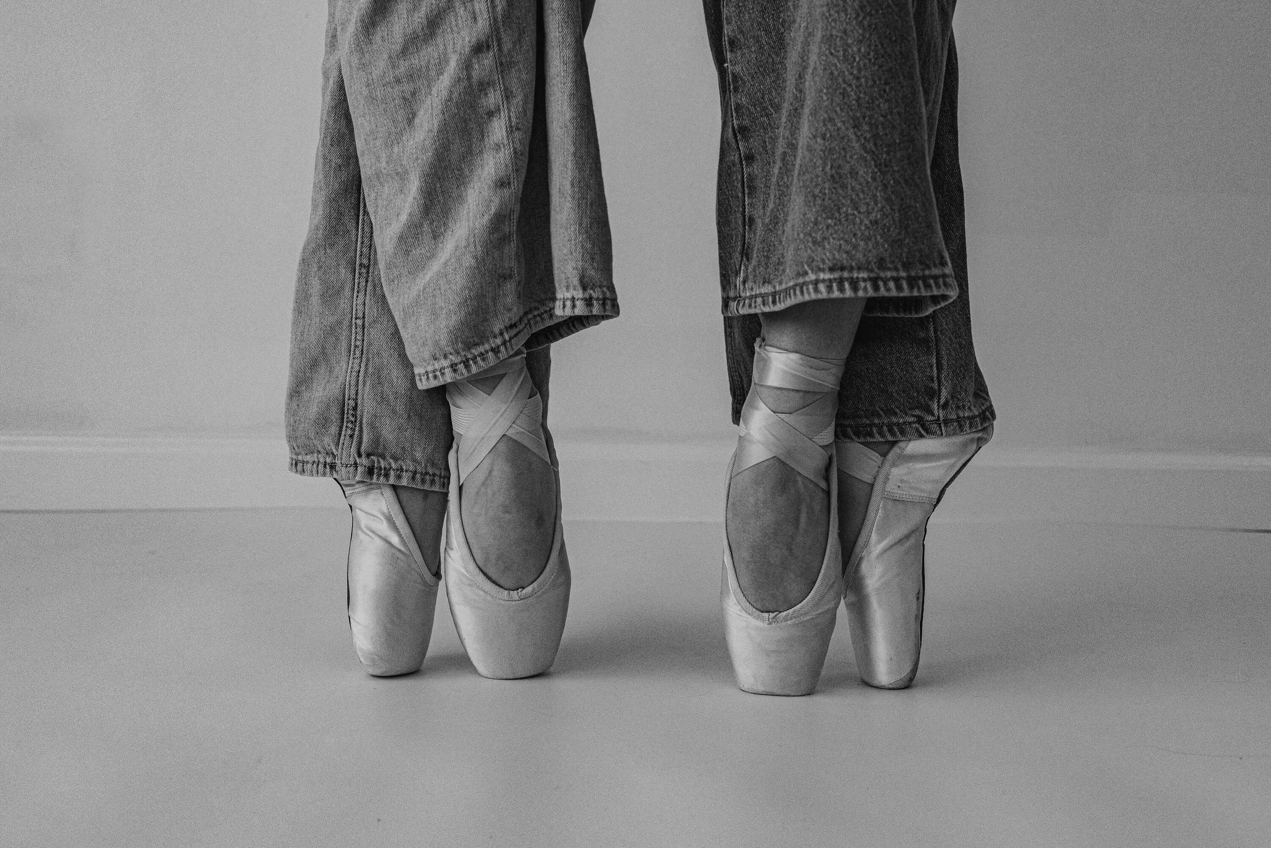 A black and white of pointe shoes