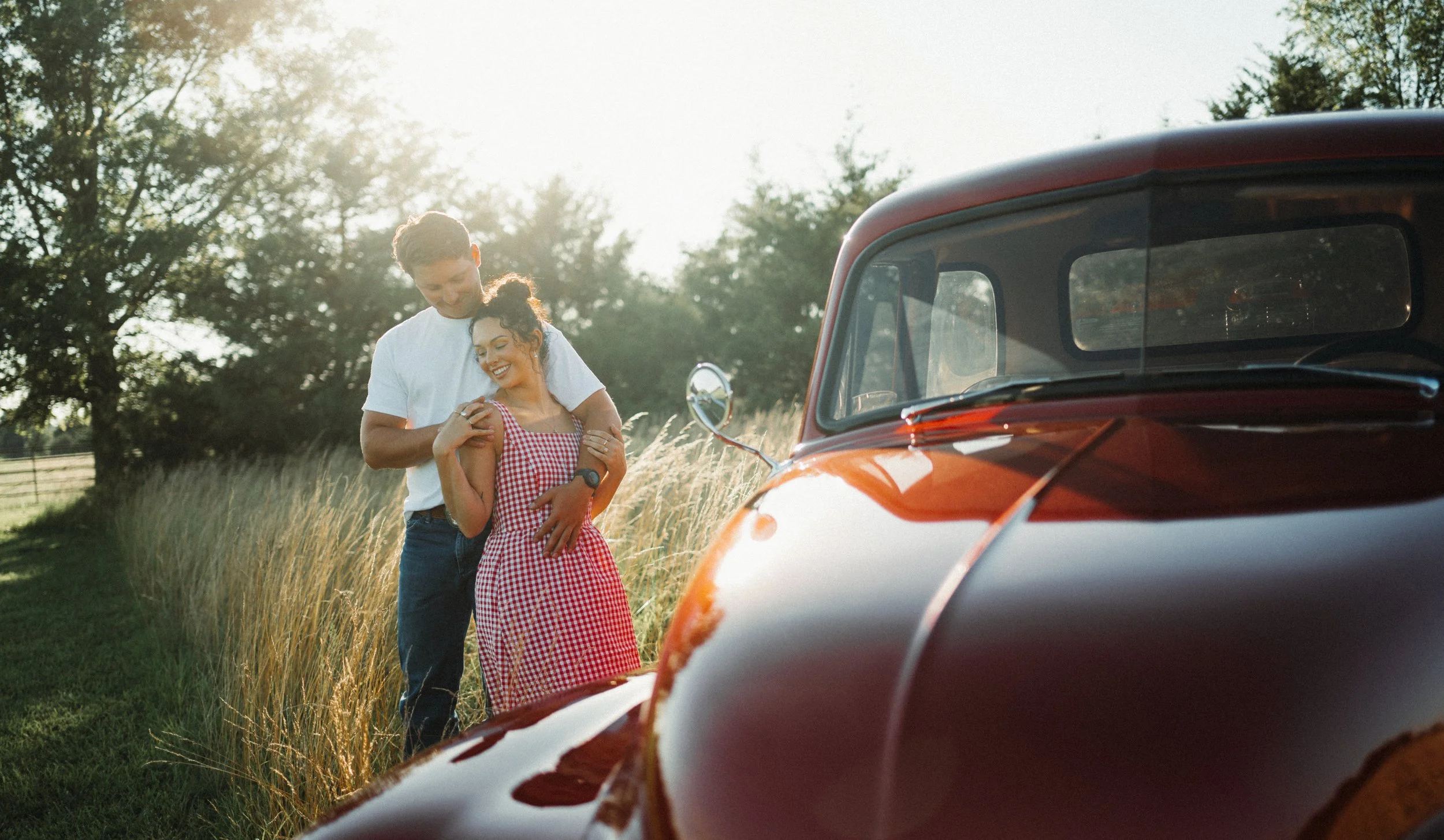 Summer country engagement photos with antique truck.